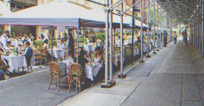 People eating at a fancy restaurant. | Shutterstock