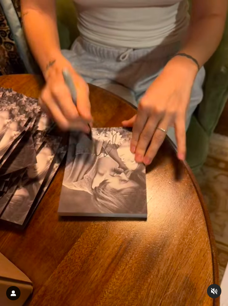 Riley Keough autographing pictures, posted on October 8, 2024 | Source: Instagram/rileykeough