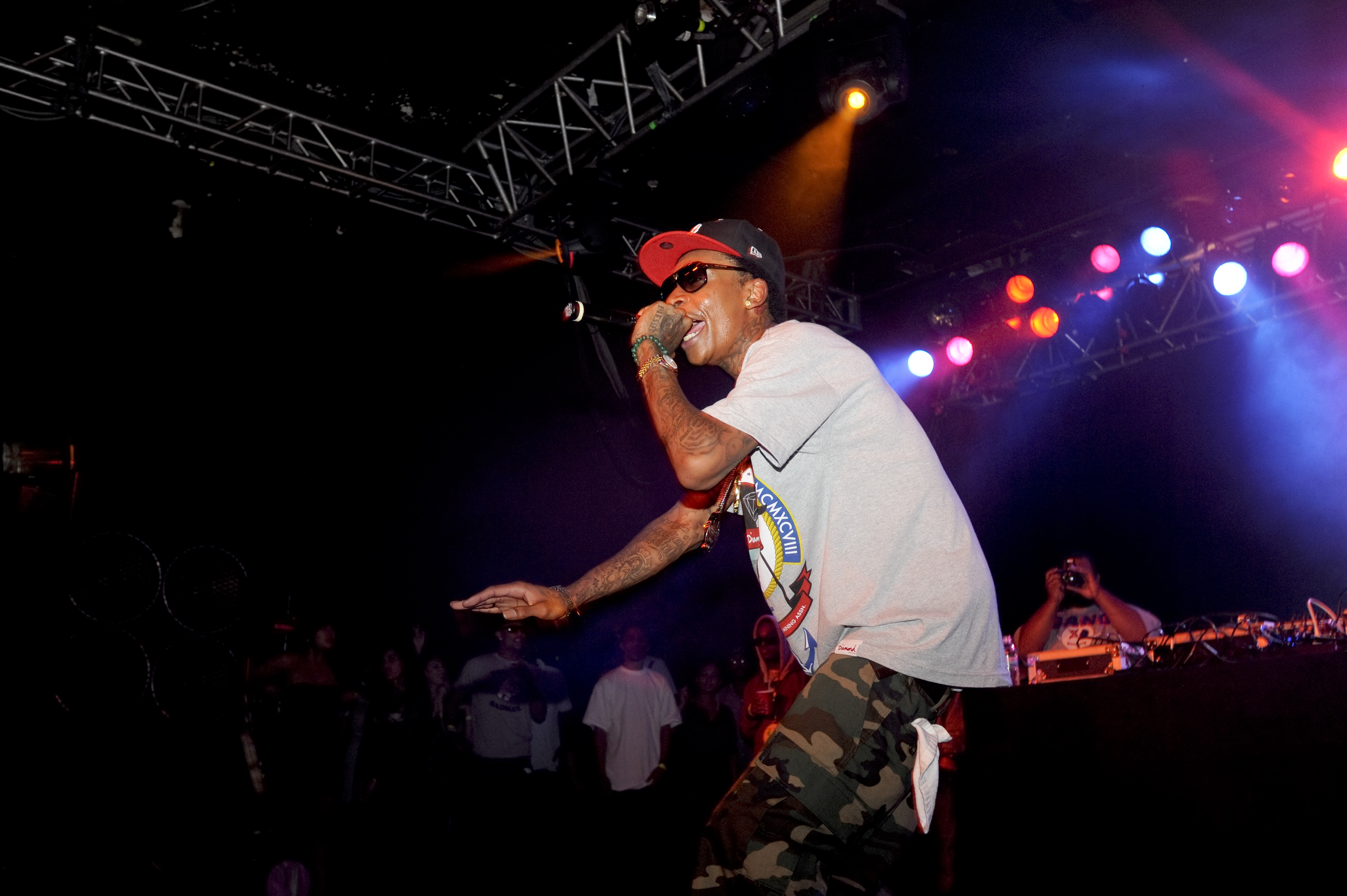 Long before his MMA transformation added 35 pounds of muscle to his frame, Wiz Khalifa was known for his lean build and laid-back stage presence. In this September 10, 2010 photo, the rapper performs at Roseland during Musicfest NW in Portland, Oregon, wearing an oversized T-shirt and camouflage pants as he energized the crowd.