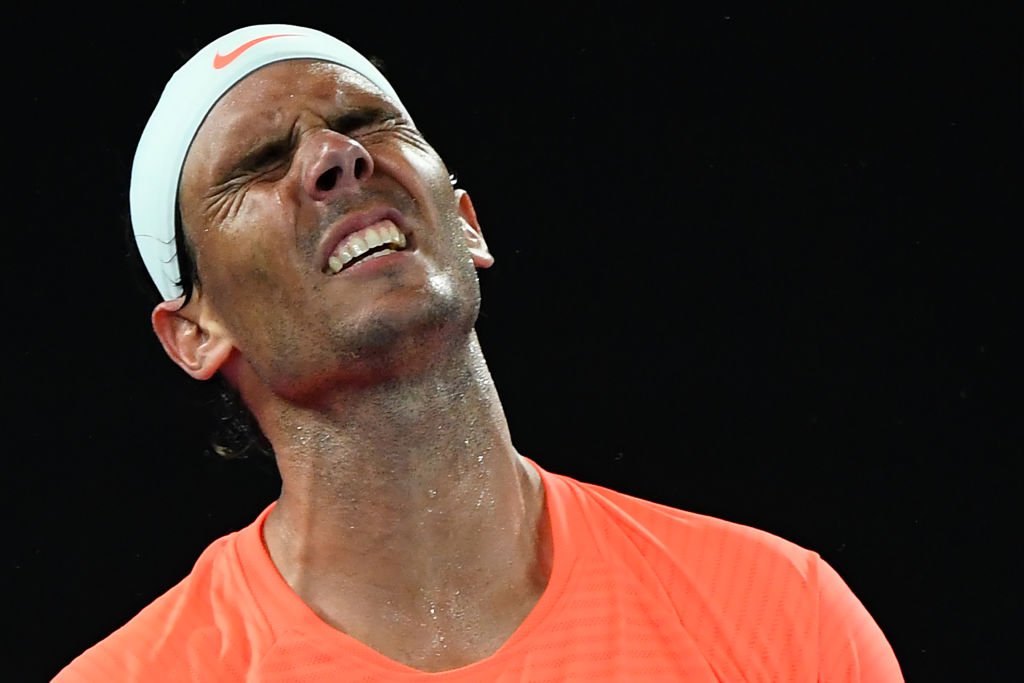 Spain's Rafael Nadal reacts after a point against Greece's Stefanos Sitcipas in their men's singles quarter-final match on the tenth day of the Australian Open tennis tournament in Melbourne on February 17, 2021.