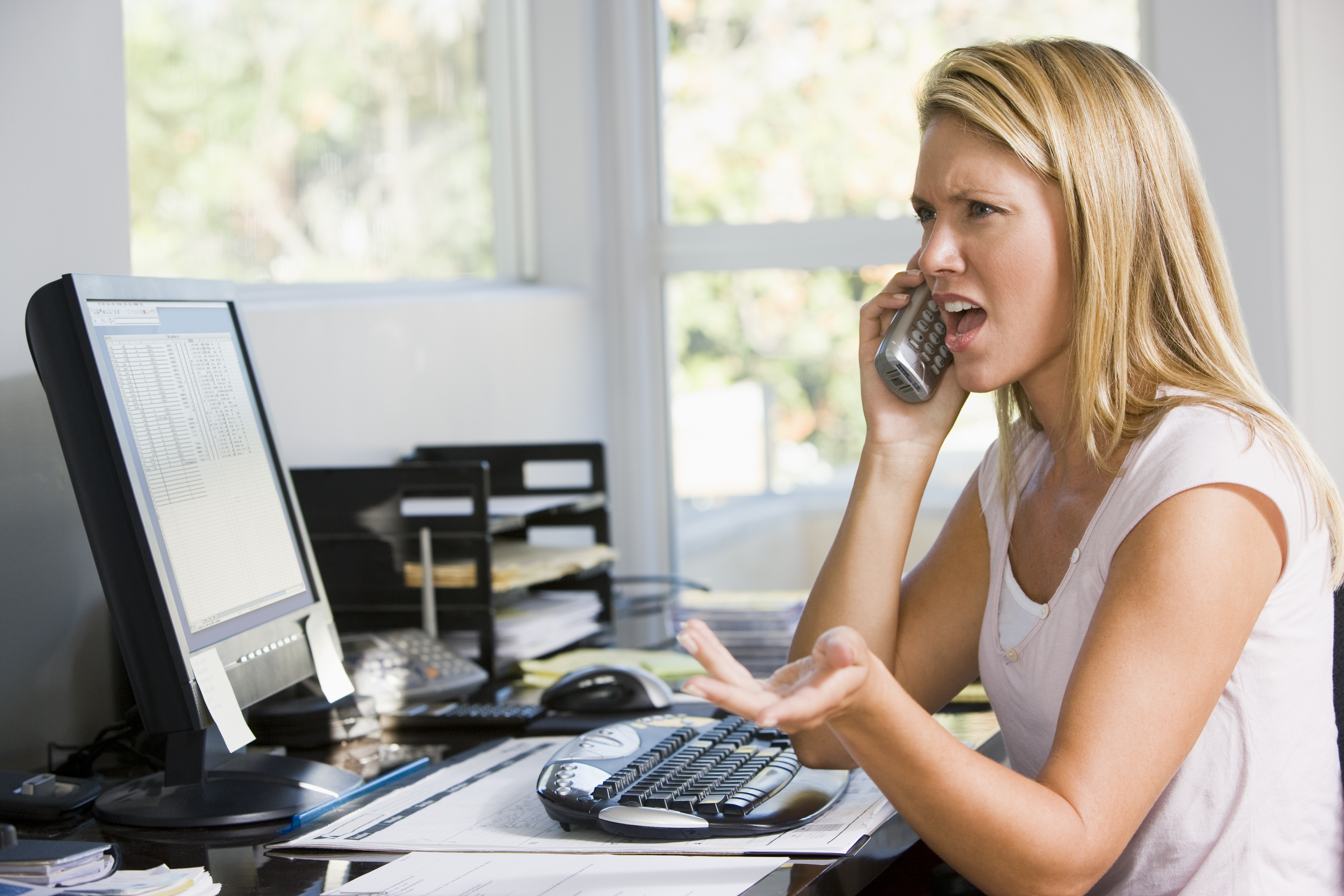 An angry woman on the phone | Source: Shutterstock