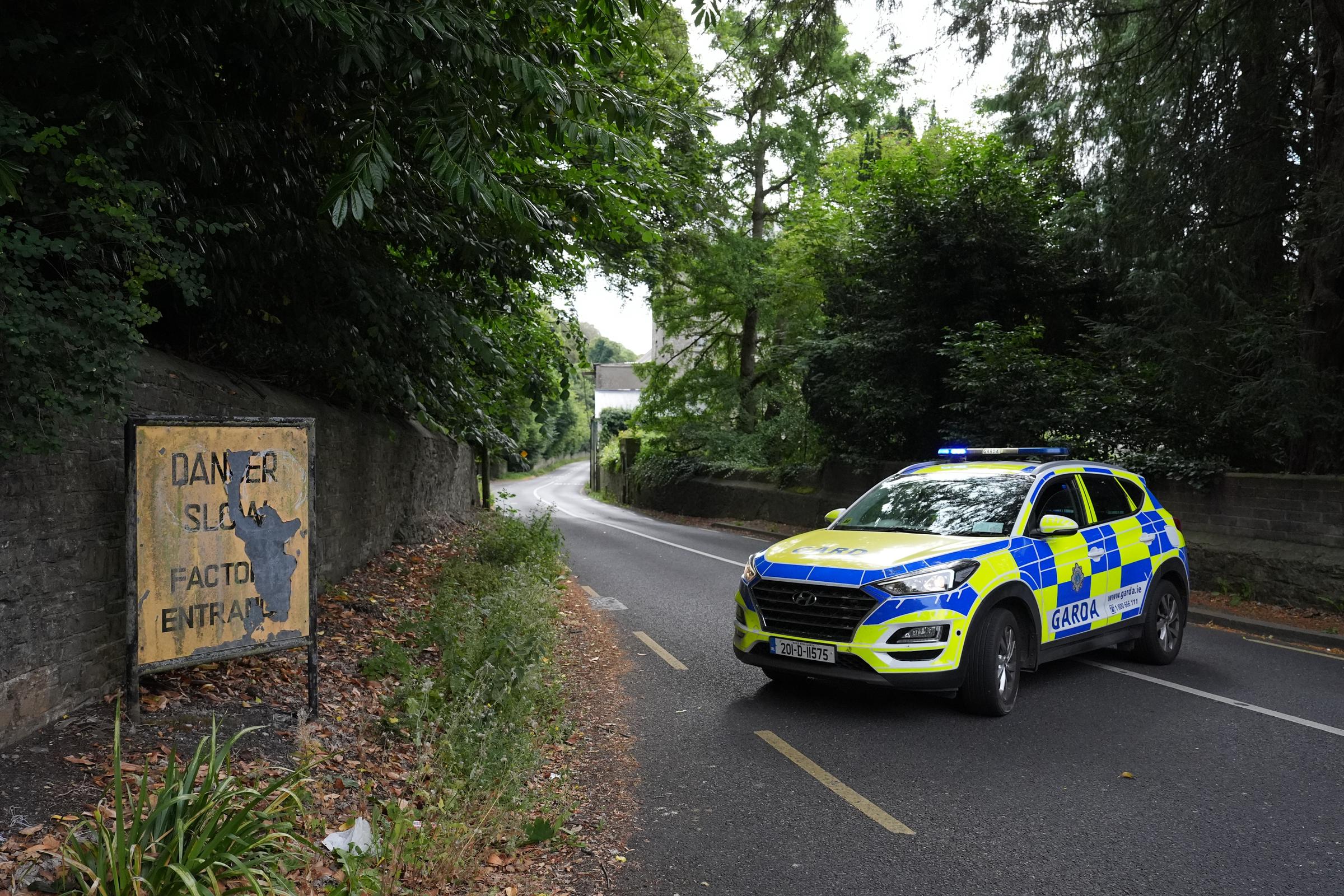 A Garda patrol car moves along the Strawberry Beds stretch, securing the perimeter immediately after the incident. This section of West Dublin was quickly closed as local traffic diversions were put into place following the devastating early-morning accident. | Source: Getty Images.