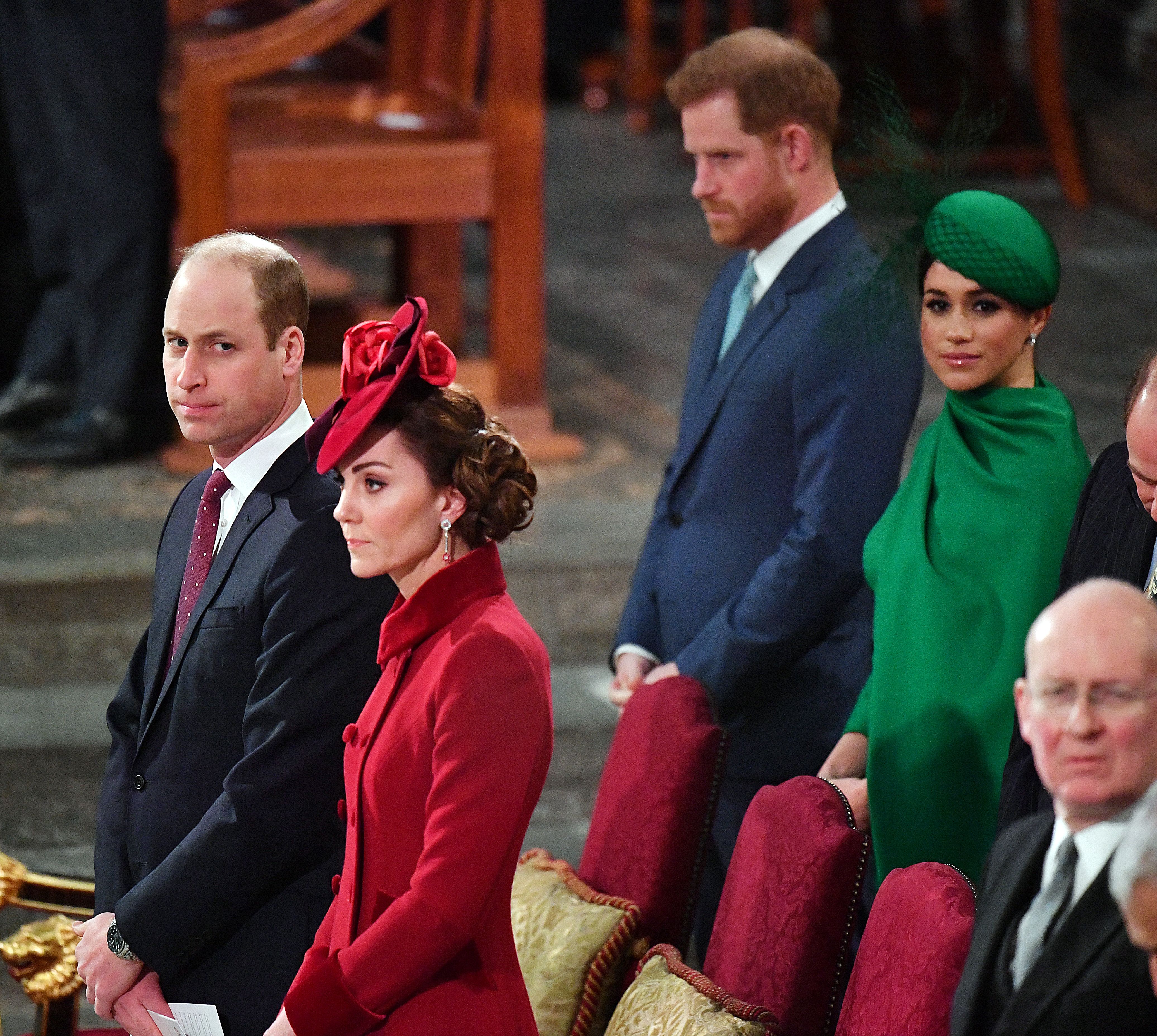 Britain's Prince Harry, Duke of Sussex, and Britain's Meghan, Duchess of Sussex sit behind Britain's Prince William, Duke of Cambridge and Britain's Catherine, Duchess of Cambridge inside Westminster Abbey as they attend the annual Commonwealth Service in London on March 9, 2020. | Source: Getty Images