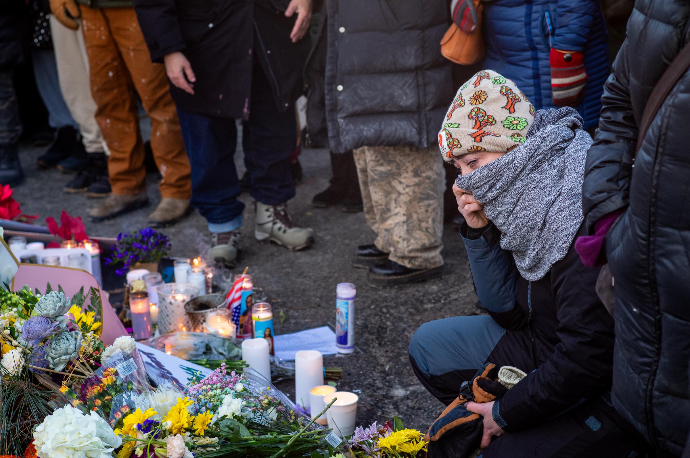 People pay their respects at a memorial site for Alex Pretti on January 25, 2026 in Minneapolis, Minnesota. | Source: Getty Images