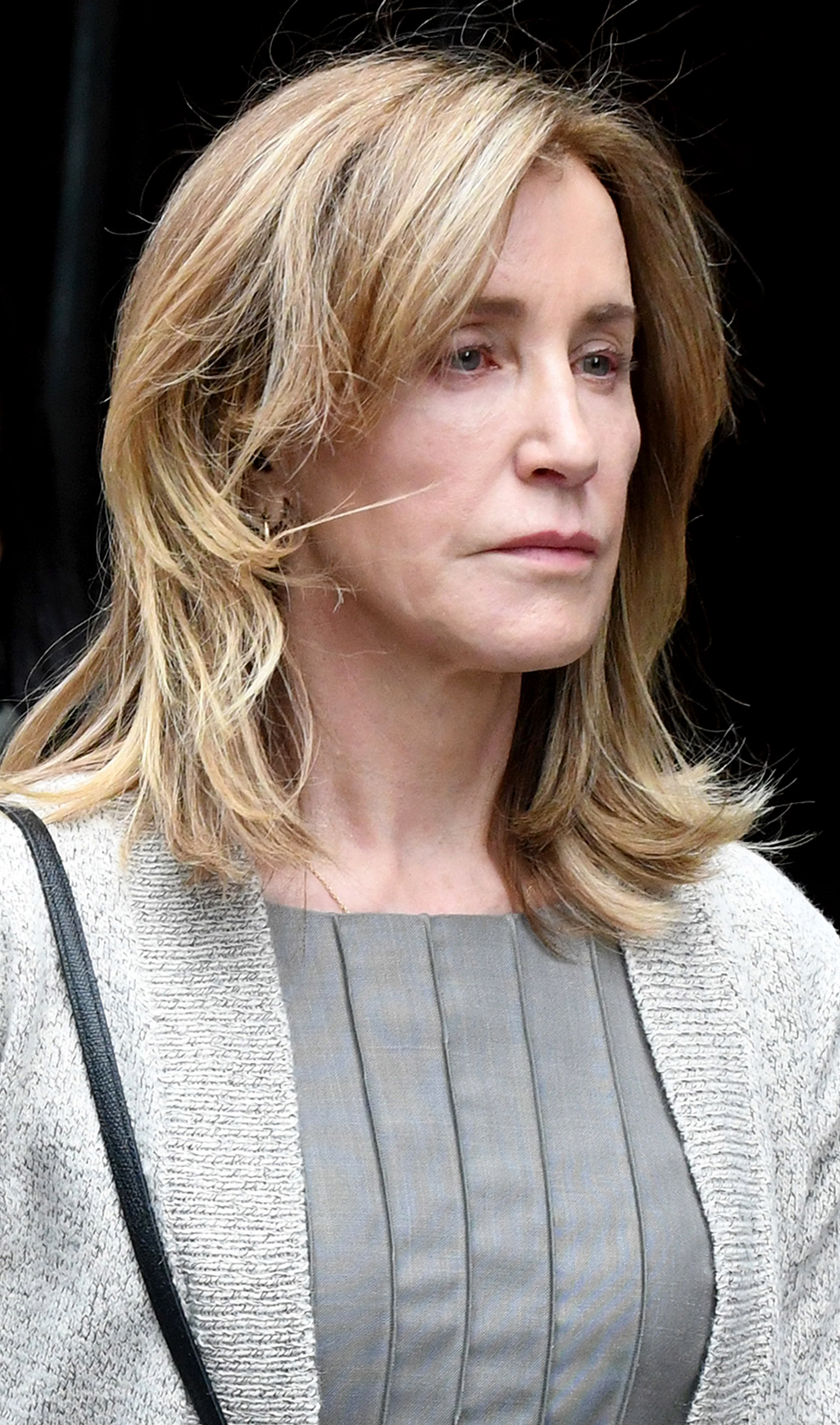 Felicity Huffman walks out of Boston Federal Court on May 13, 2019, in Boston. | Source: Getty Images
