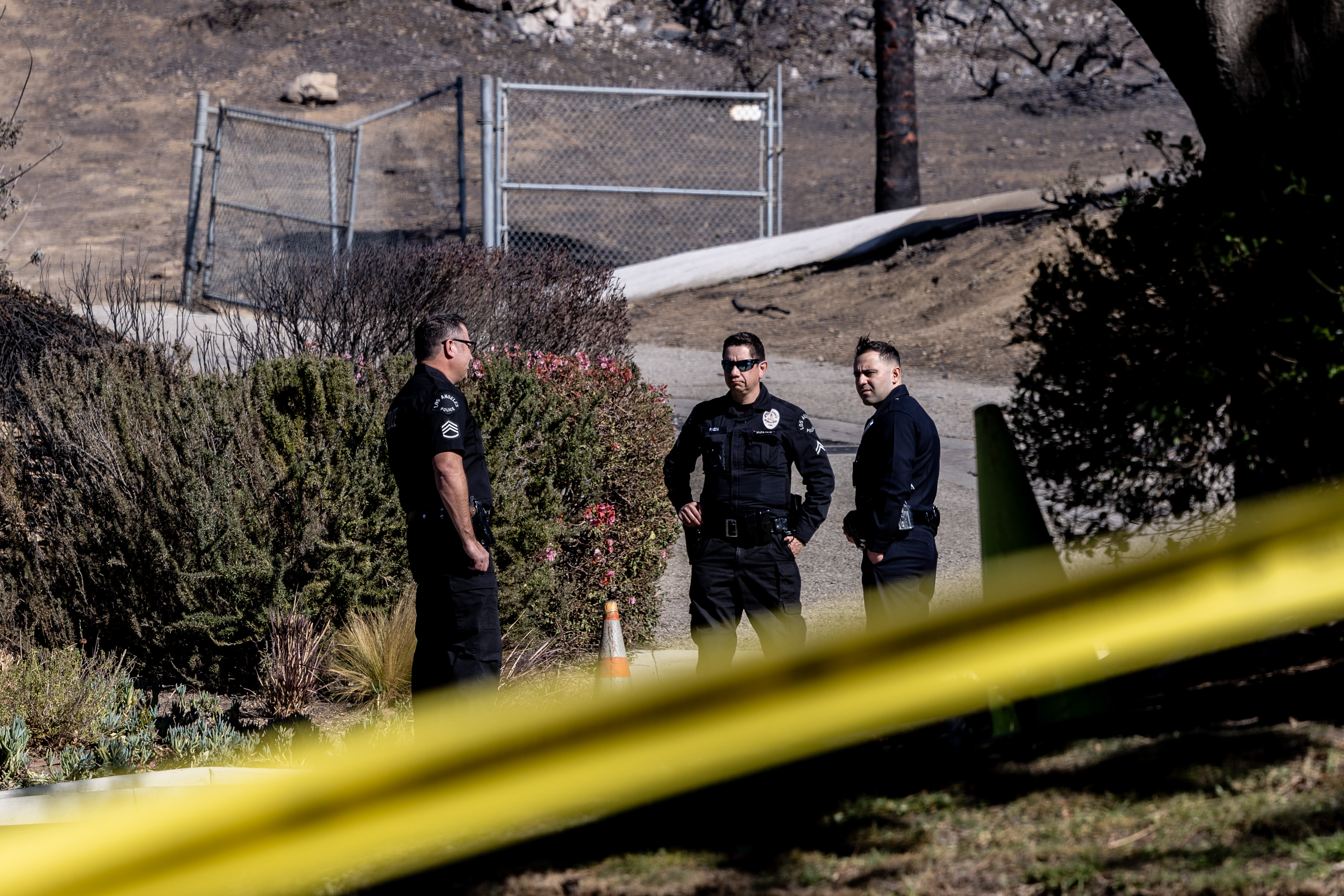 Officers at Skull Rock Trailhead as they investigate the area in the Pacific Palisades, California on January 13, 2025. | Source: Getty Images