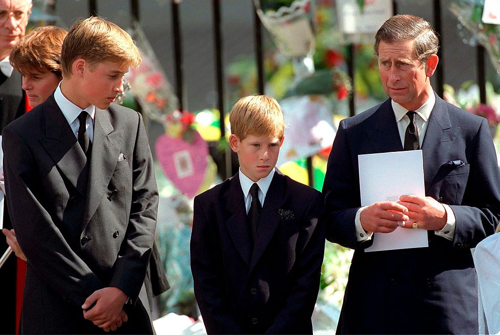 Prince William, Prince Harry, and Prince Charles at Westminster Abbey for Princess Diana's funeral in London on September 6, 1997. | Source: Tim Graham Photo Library/Getty Images