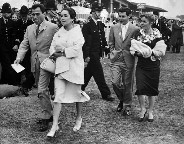 Elizabeth Taylor, Mike Todd, Eddie Fisher, and Debbie Reynolds on June 5, 1957 as they attended the running of the English Derby in Epsom. | Photo: Getty Images