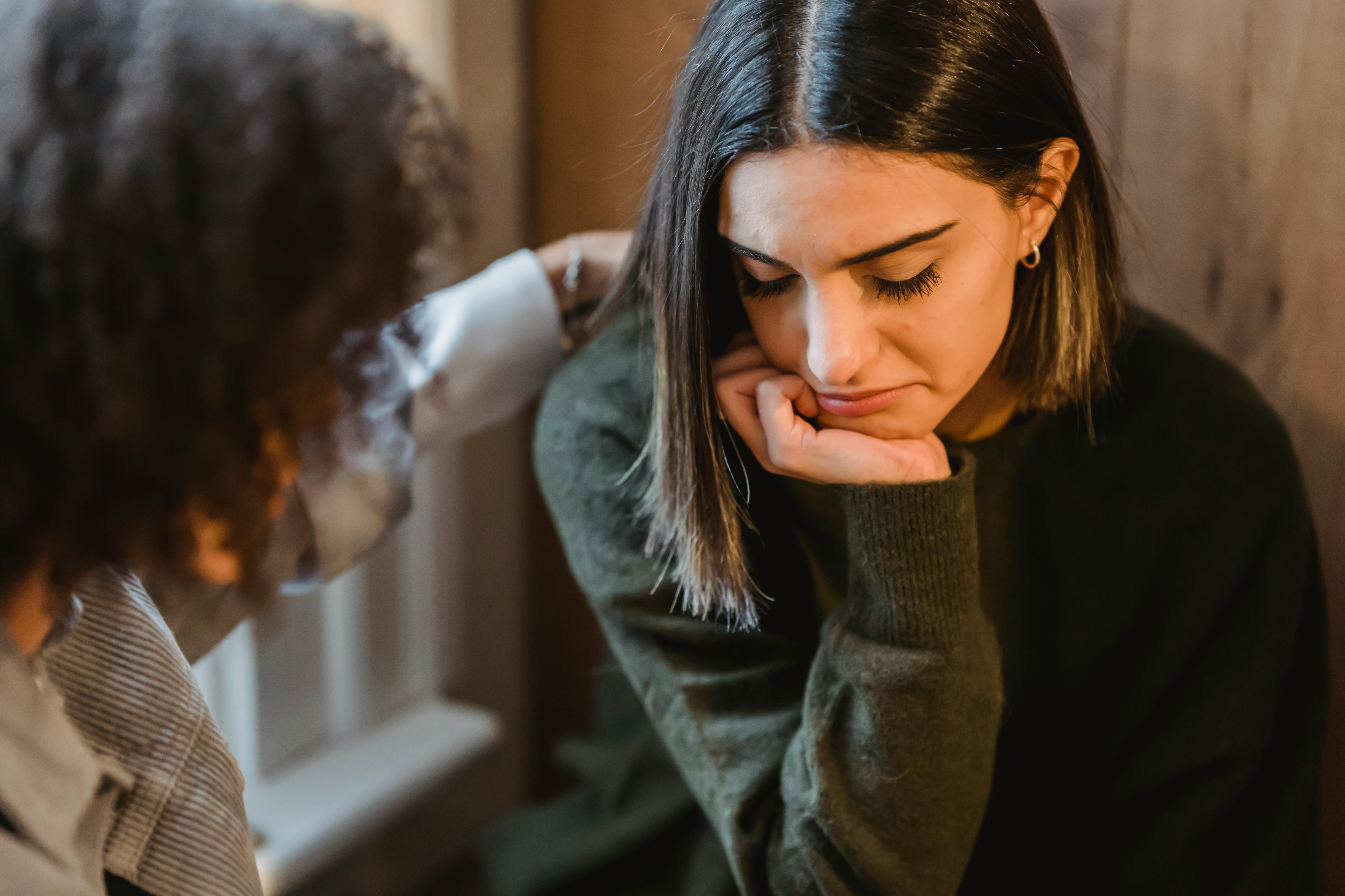 A young woman being comforted by her friend | Source: Liza Summer on Pexels