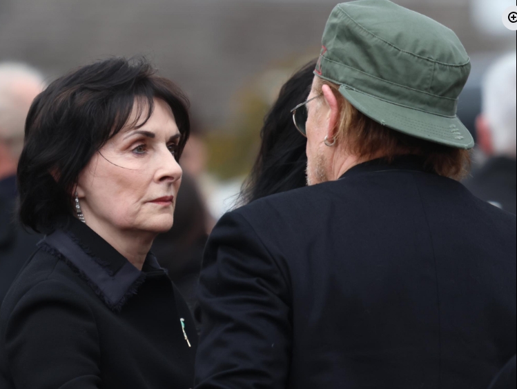 A sombre exchange unfolded outside the service as a well-known figure shared a quiet moment with Moya Brennan's sister Enya during the gathering to honour the Irish musician. | Source: Facebook/Irish Daily Mirror