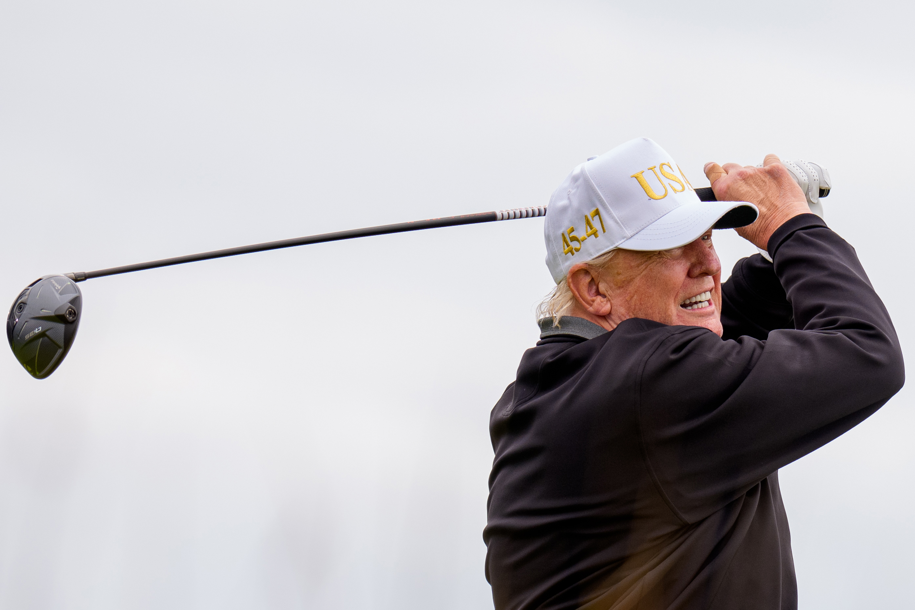 Donald Trump tees off at a new 18-hole course at Trump International Golf Links on July 29, 2025 in Balmedie, near Aberdeen, Scotland | Source: Getty Images