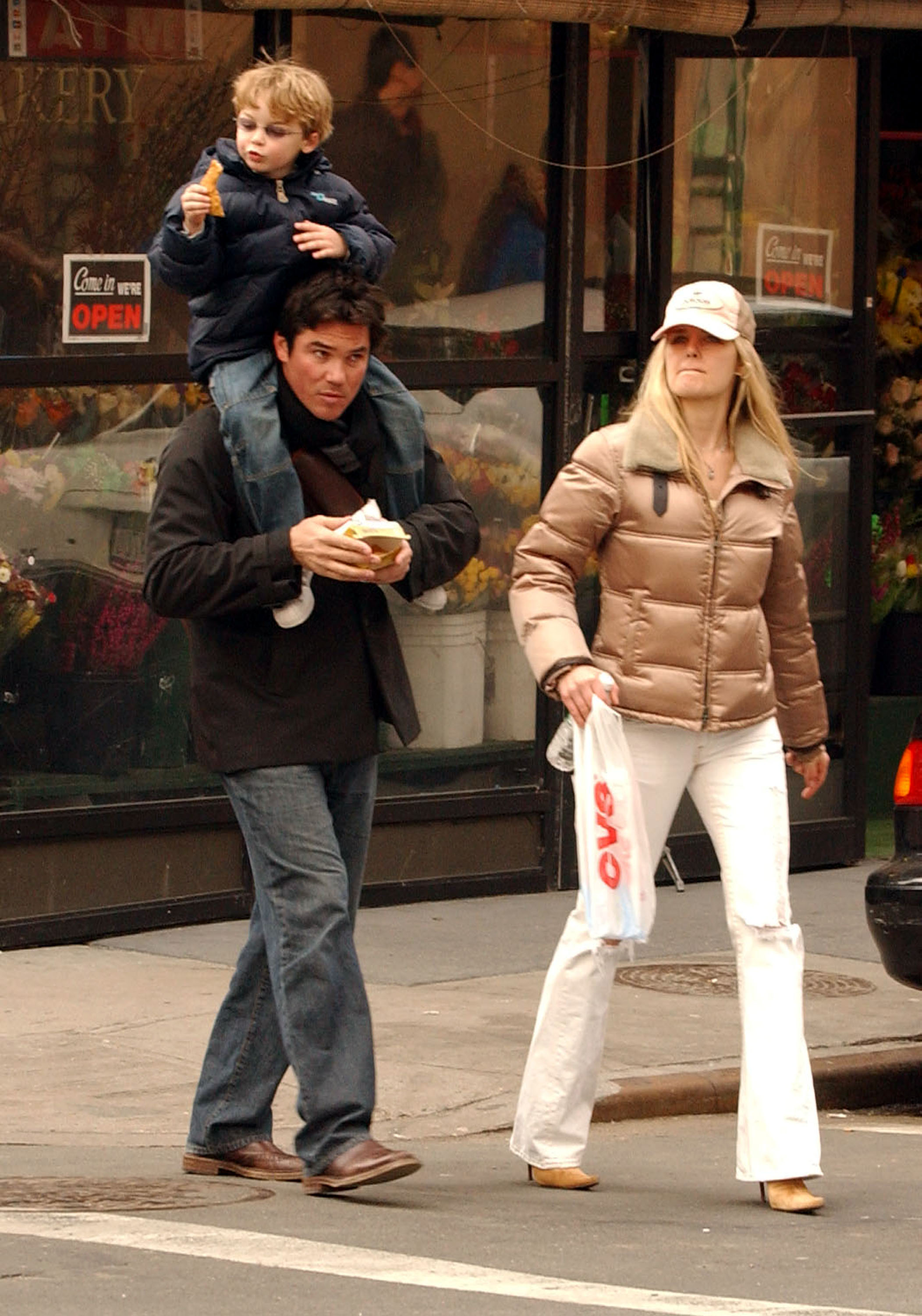 Dean Cain, his son Christopher, and the boy's mother Samantha Torres take a walk in the West Village in New York City on March 17, 2005 | Source: Getty Images