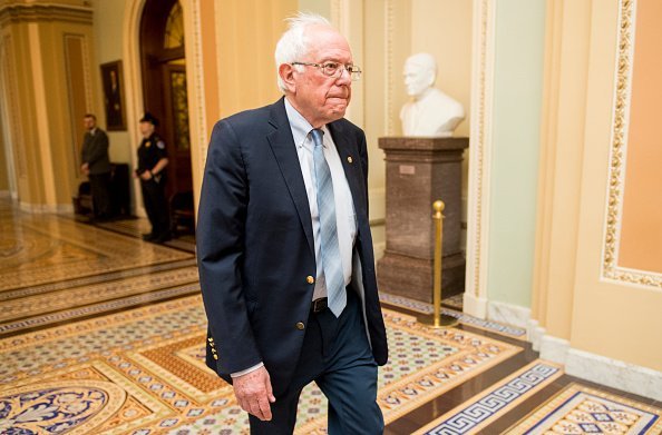  Sen. Bernie Sanders walking through the Ohio Clock Corridor in the Senate chamber | Photo: Getty Images