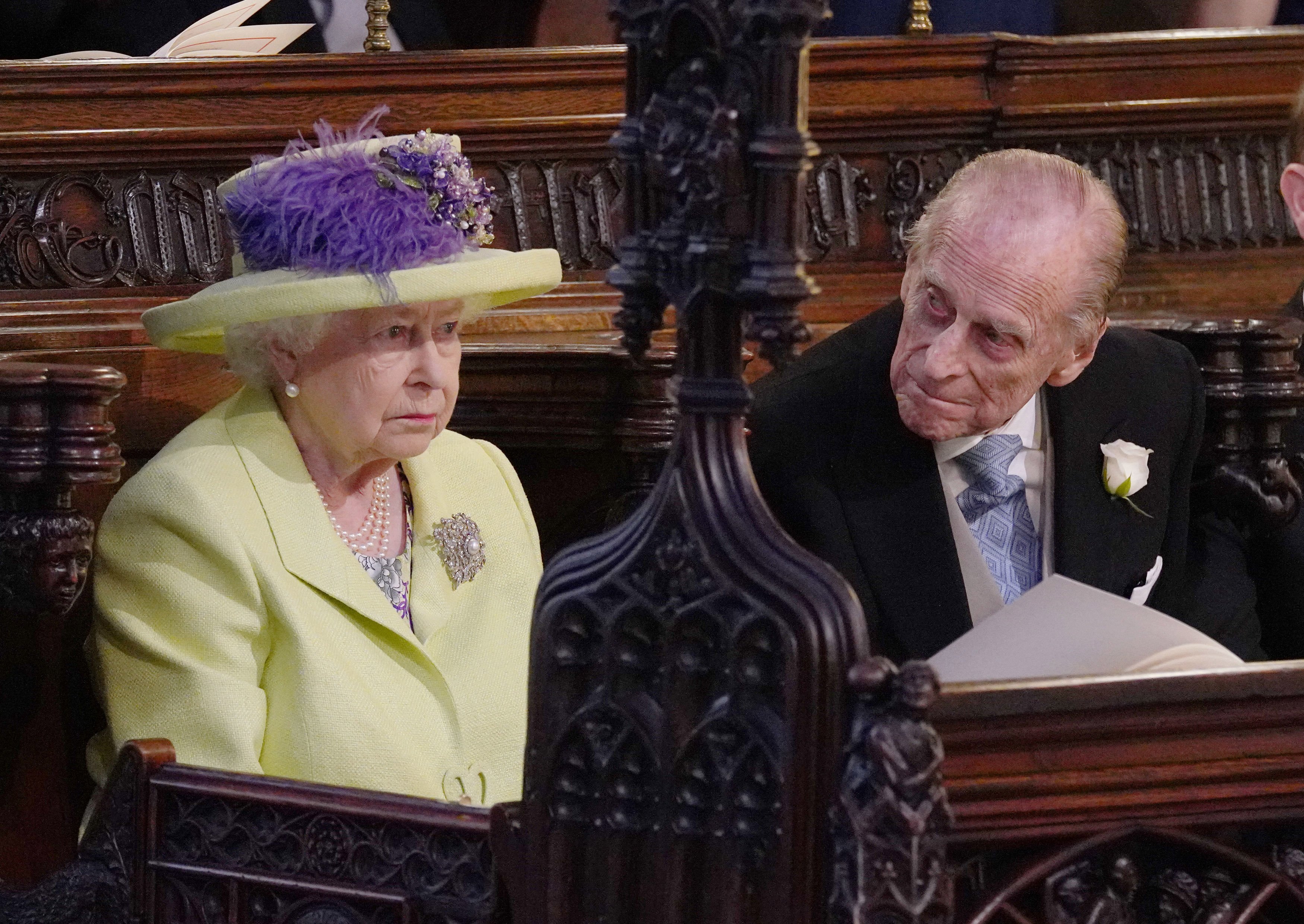 Queen Elizabeth II and Prince Philip, Duke of Edinburgh at the wedding of Prince Harry to Meghan Markle  at Windsor Castle on May 19, 2018 in Windsor, England. | Source: Getty Images 