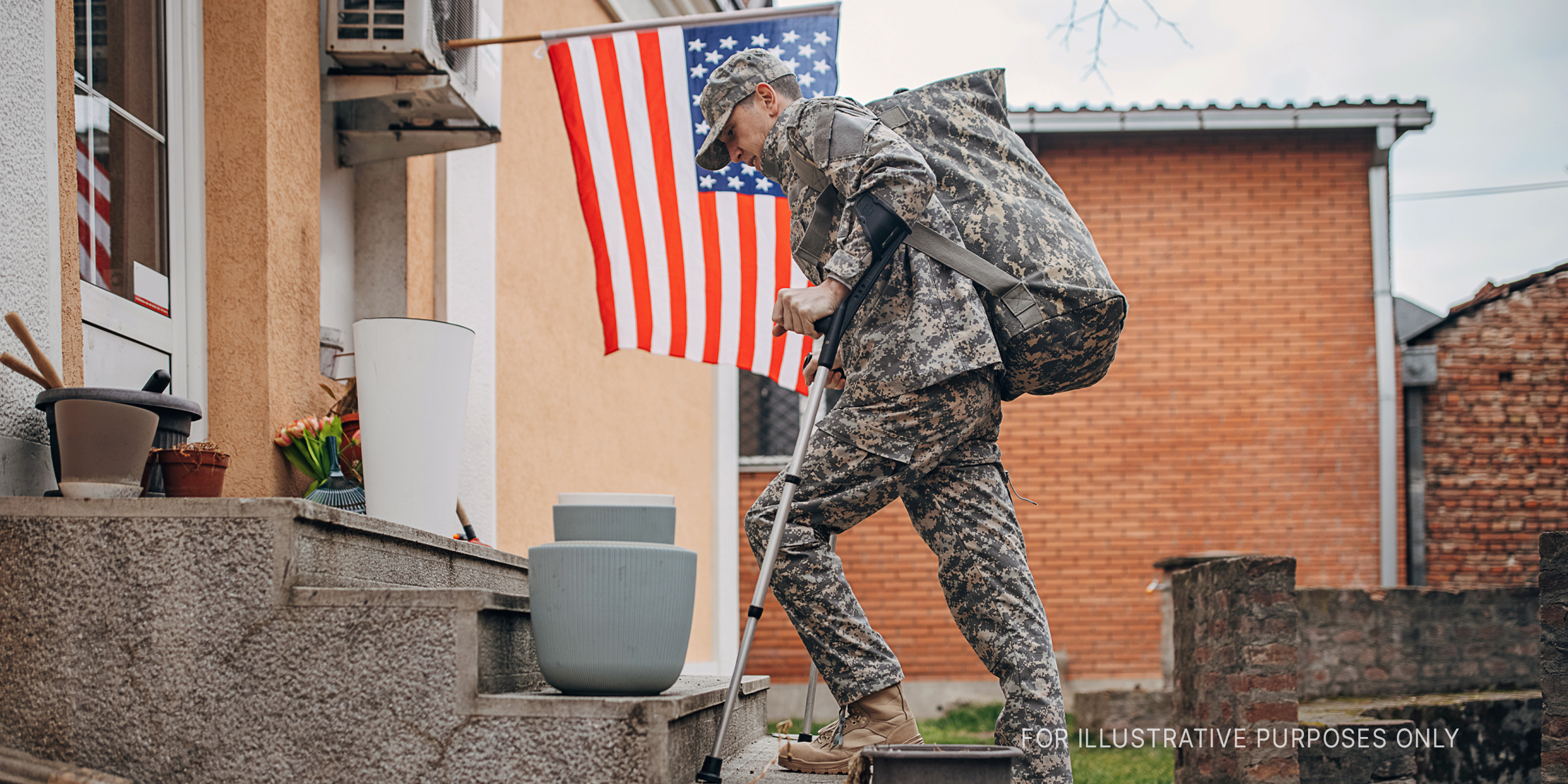 A soldier standing outside a house | Source: Getty Images