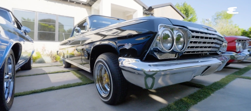A side view of Wiz Khalifa's 1962 Chevrolet Impala, the custom lowrider he continued modifying after receiving career-changing advice from Snoop Dogg. | Source: YouTube/Esquire