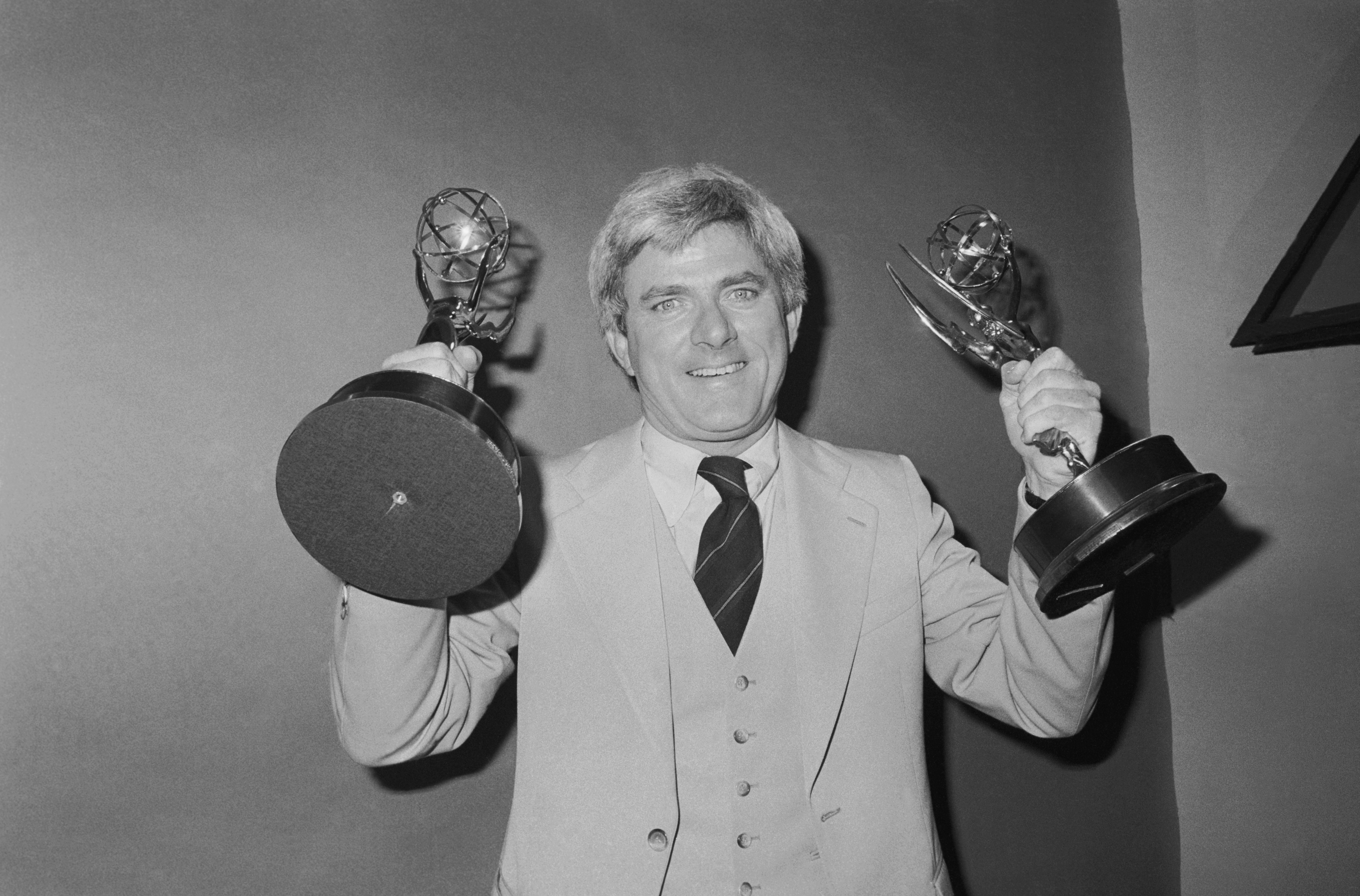 Phil Donahue posing with his Emmy awards in New York in 1979. | Source: Getty Images