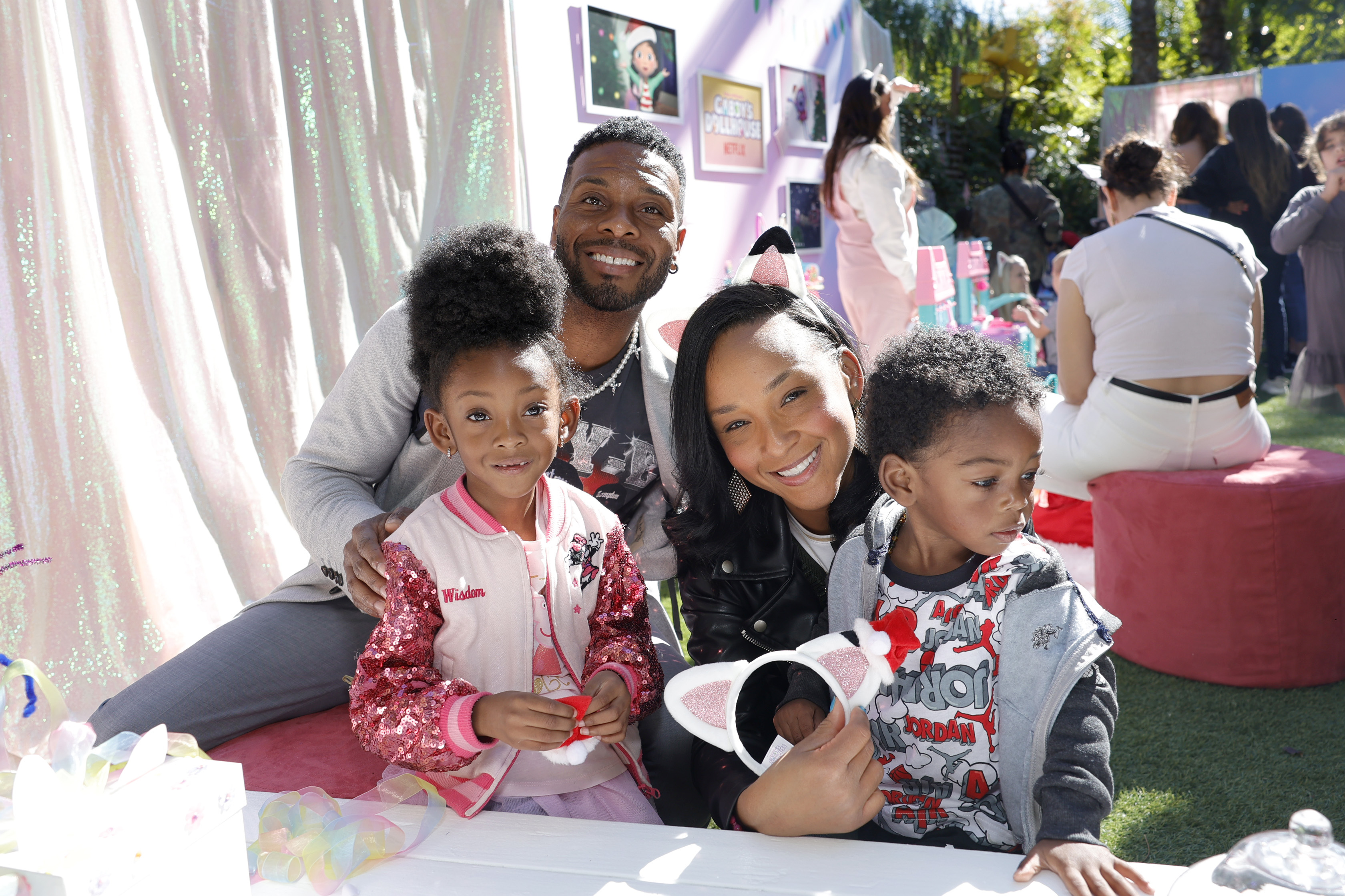 (L-R) Wisdom Mitchell, Kel Mitchell, Asia Lee, and Honor Mitchell attend Gabby's Dollhouse Cat-mas Spectacular at Second Home Hollywood, on November 13, 2022, in Los Angeles, California. | Source: Getty Images