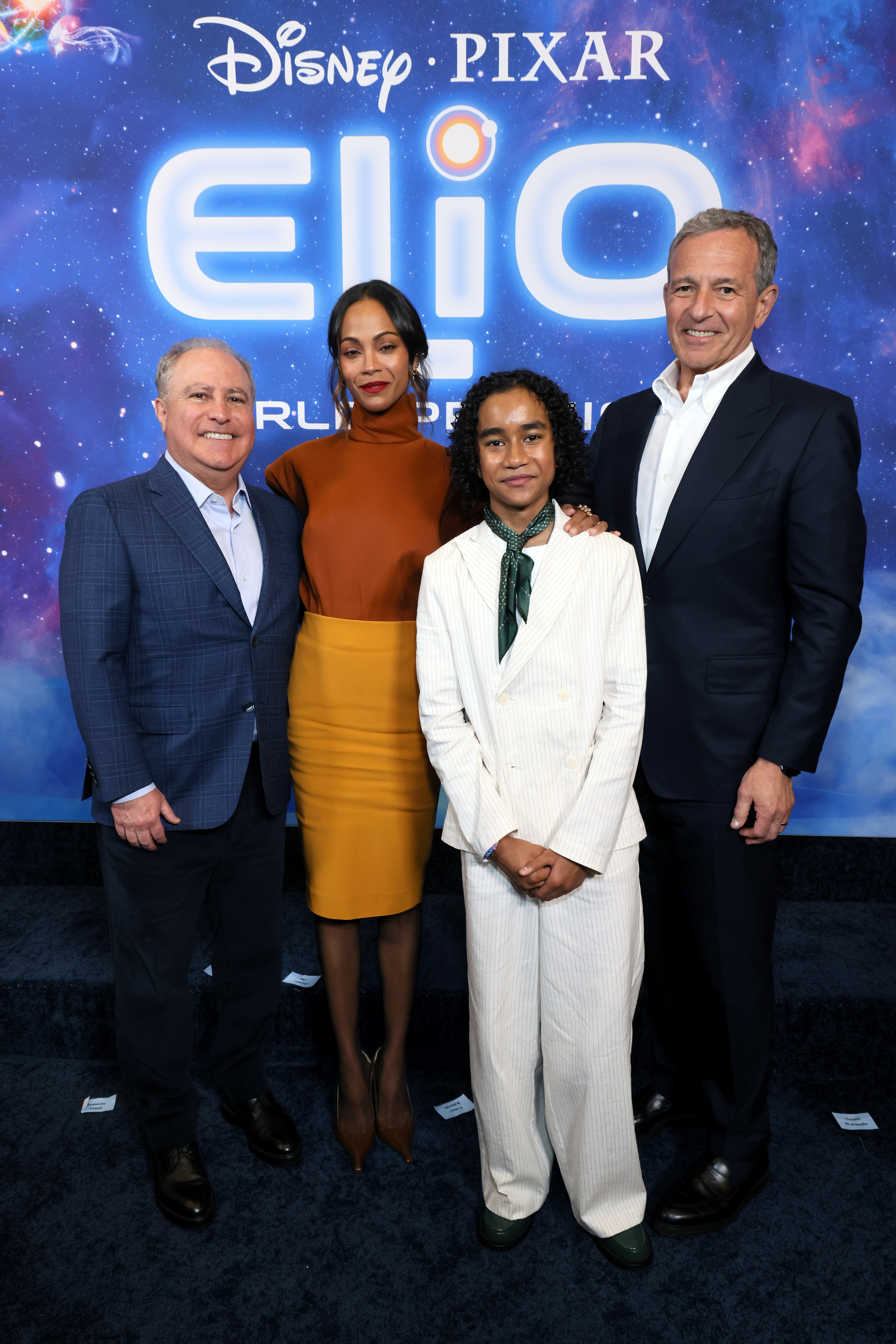 Zoe Saldaña with Disney Entertainment Co-Chairman Alan Bergman, Walt Disney Company CEO Bob Iger, and Yonas Kibreab at the movie premiere.