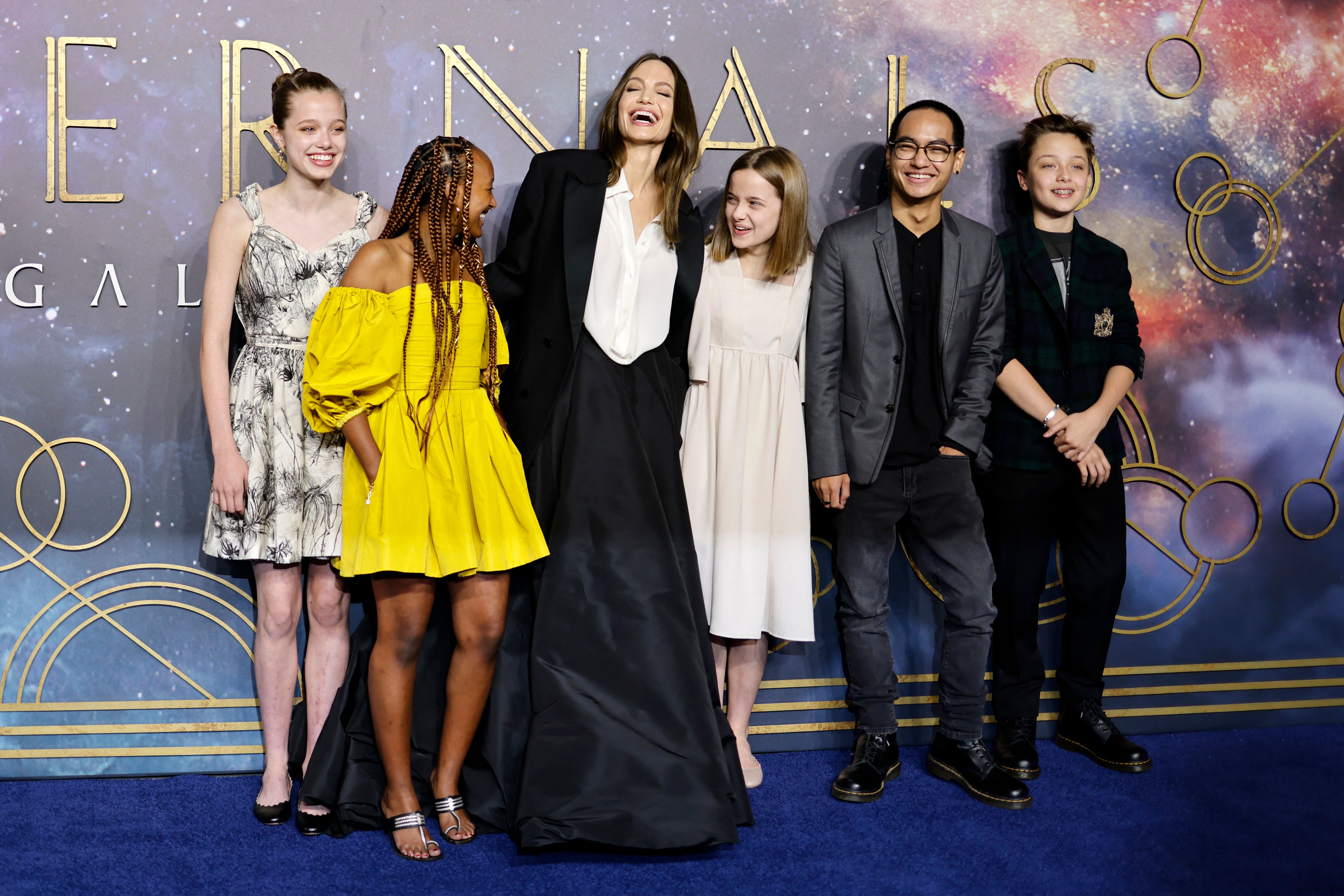 Shiloh, Zahara, Angeline Jolie, Vivienne, Maddox, and Knox Jolie-Pitt on the blue carpet on arrival to attend the UK Gala Screening of the film 'Eternals', at the BFI IMAX in London on October 27, 2021. | Source: Getty Images
