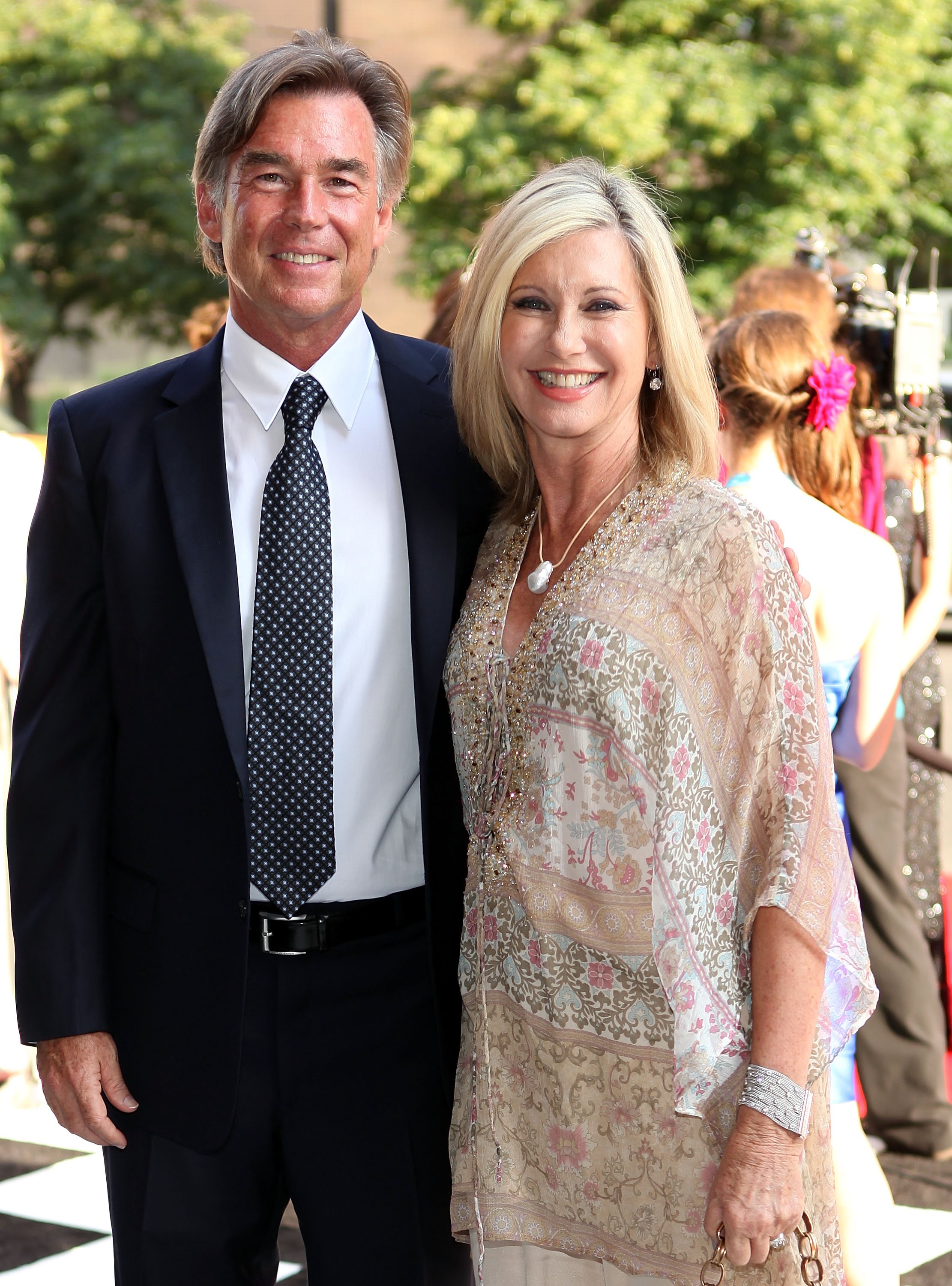 John Easterling and Olivia Newton-John at 2012 Indy 500 Snakepit Ball at Indiana Roof Ballroom on May 26, 2012 in Indianapolis, Indiana. | Source: Getty Images 