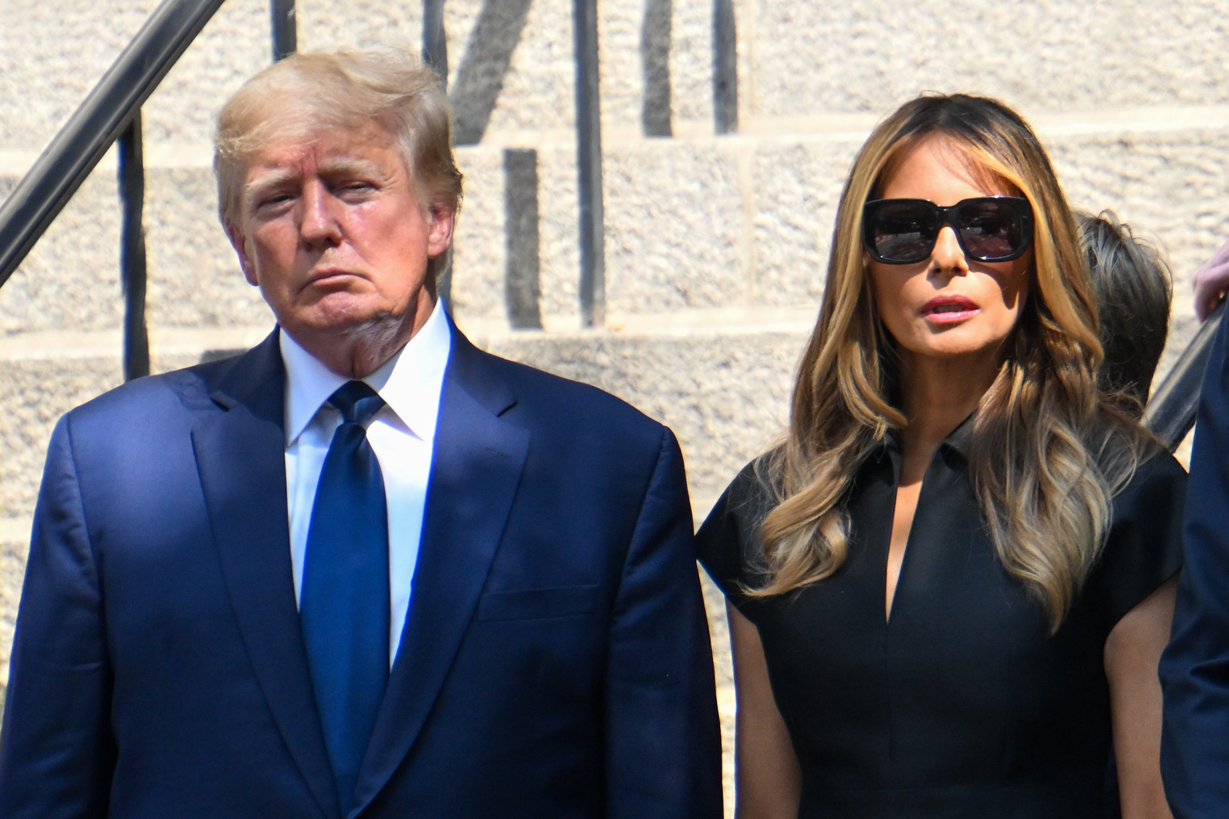 Former President Donald J. Trump and his wife Melania Trump exit the funeral of Ivana Trump at St. Vincent Ferrer Roman Catholic Church on July 20, 2022 in New York City.┃Source: Getty Images