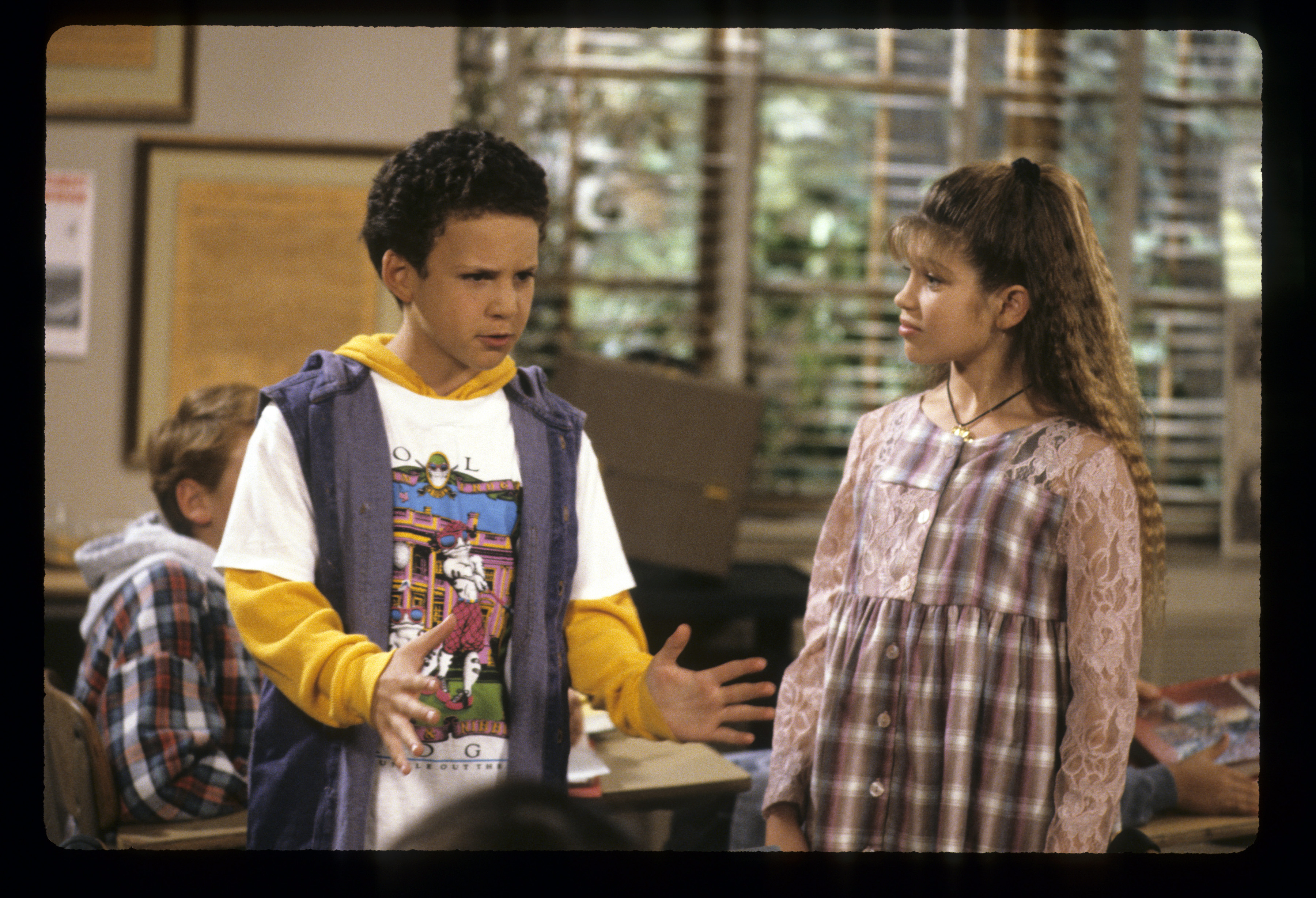 Ben Savage as Cory Matthews with the young actress who played Topanga Lawrence, in a "Boy Meets World" episode dated December 17, 1993 | Source: Getty Images