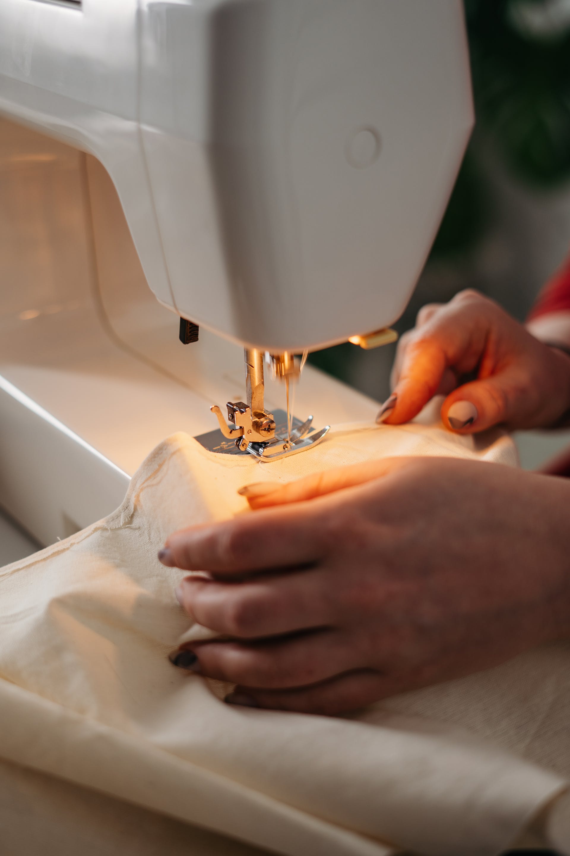 Person using a sewing machine | Source: Pexels