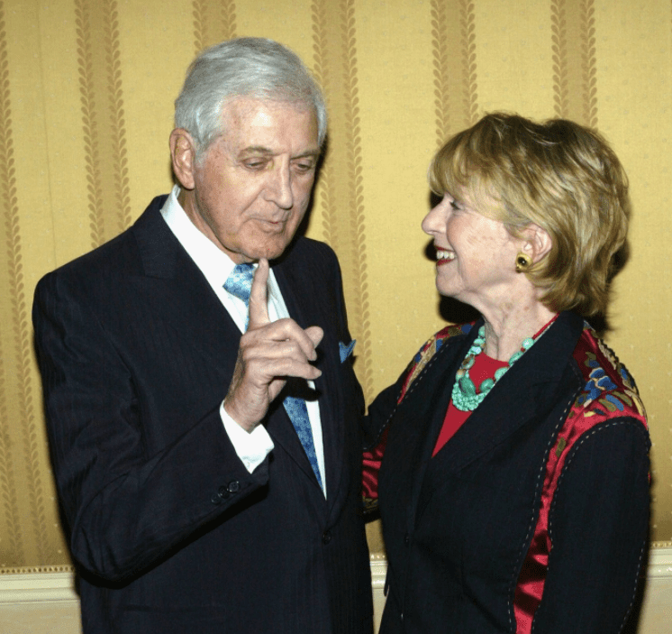 Former television host Monty Hall makes a point to his wife Marilyn during the inaugural internationally televised program "Temple of the Air" at the Four Season Hotel Beverly Hills on April 24, 2003 in Beverly Hills, California | Photo: Getty Images