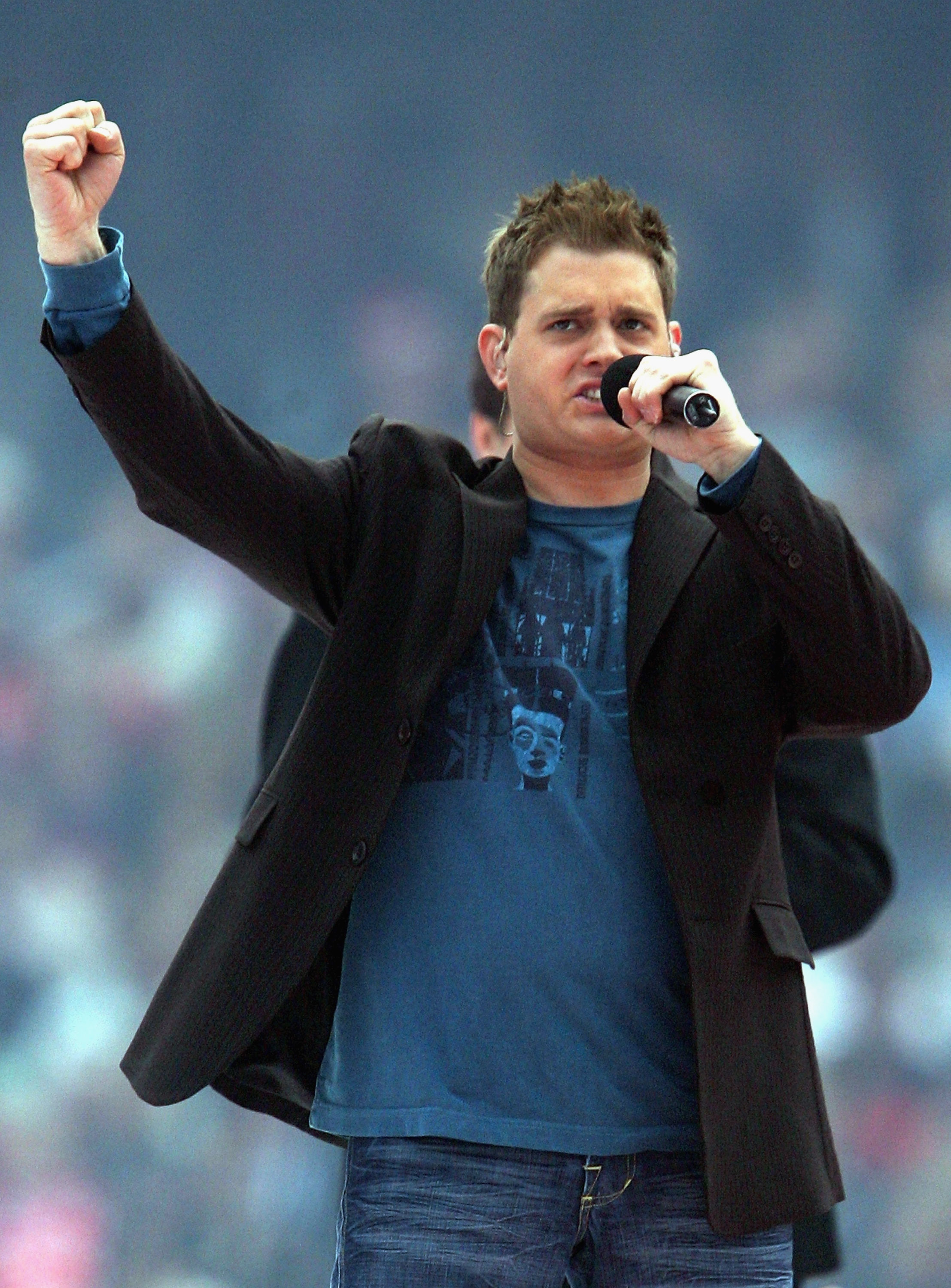 Michael Bublé performs before the 2005 AFL Grand Final at the Melbourne Cricket Ground on September 24, 2005, in Melbourne, Australia | Source: Getty Images