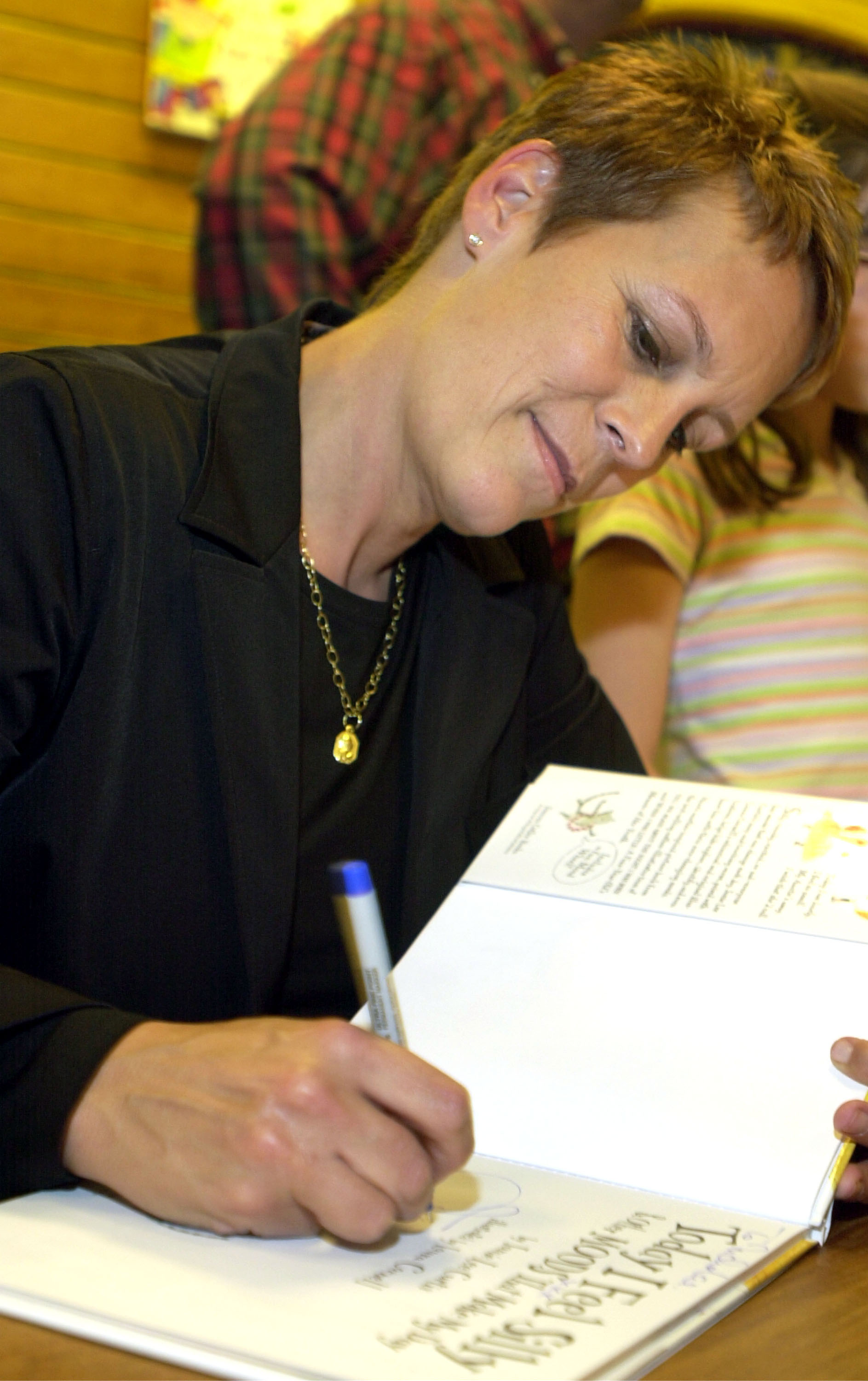 Jamie Lee Curtis signs copies of her new book "I'm Gonna Like Me: Letting Off A Little Self-Esteem" during a stop on her book tour at Joseph-Beth Booksellers October 3, 2002 in Cincinnati, Ohio | Source: Getty Images