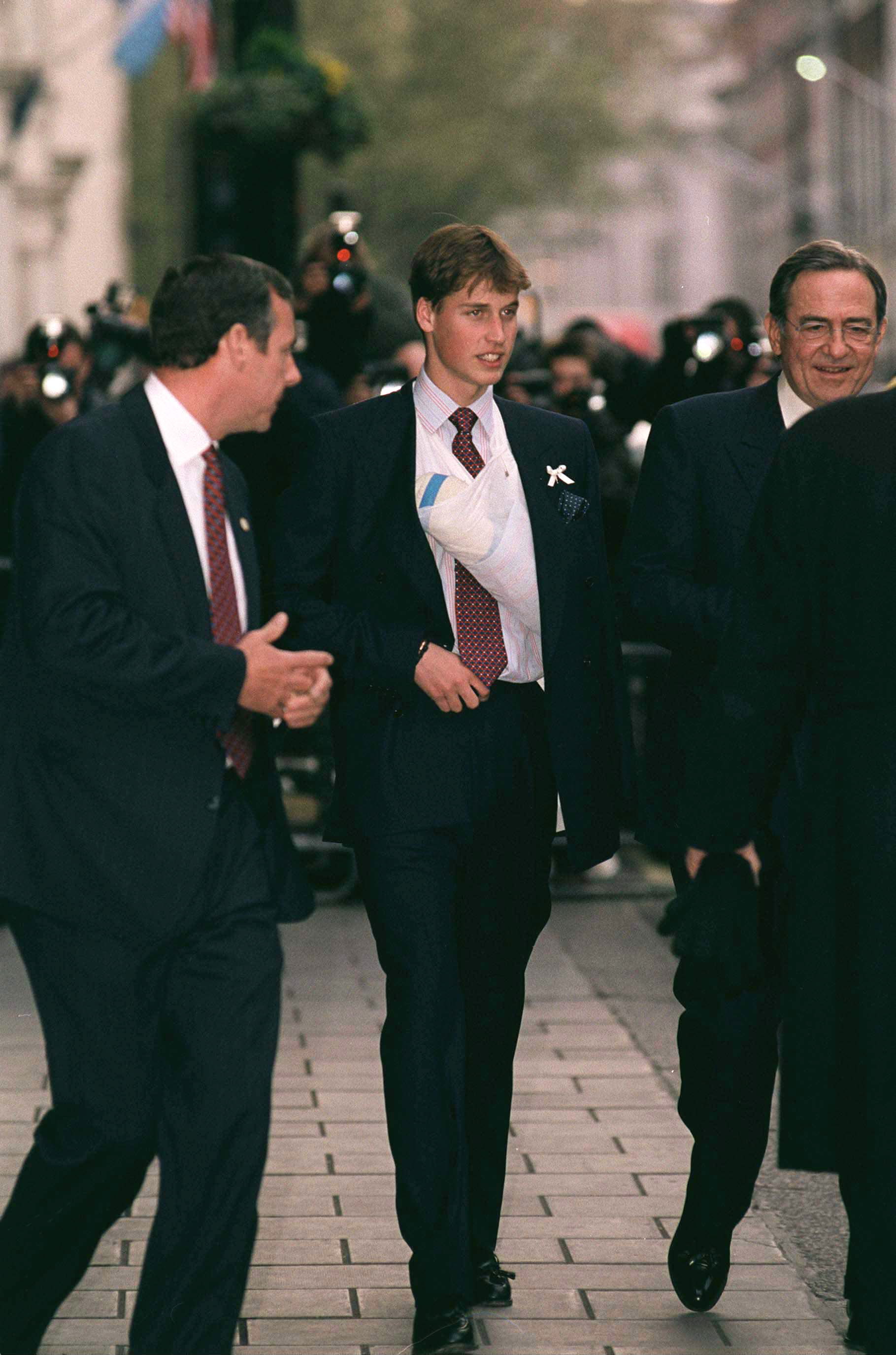 William, Prince of Wales, arrived at the Greek Cathedral of Saint Sophia in London wearing a sling after a sporting injury, drawing attention from the press as he joined other royals for the christening of his godson, Prince Constantine-Alexios of Greece.