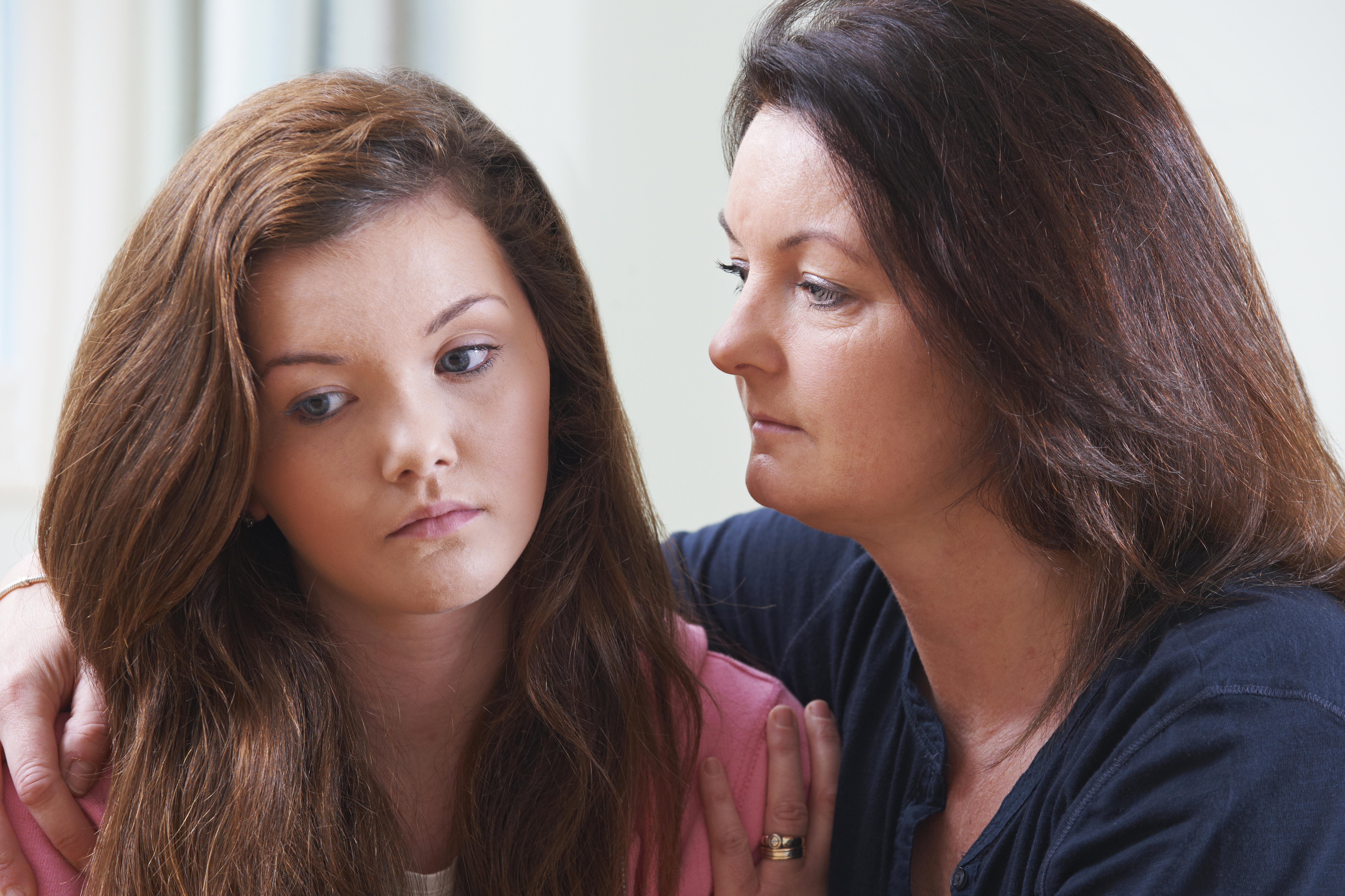A mother comforting her teenage daughter | Source: Shutterstock