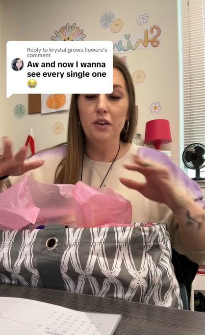 Mrs. White getting ready to show some of the hats her mother created for her second-grade class for Christmas on TikTok on December 5, 2023 | Source: TikTok/Mrs. White
