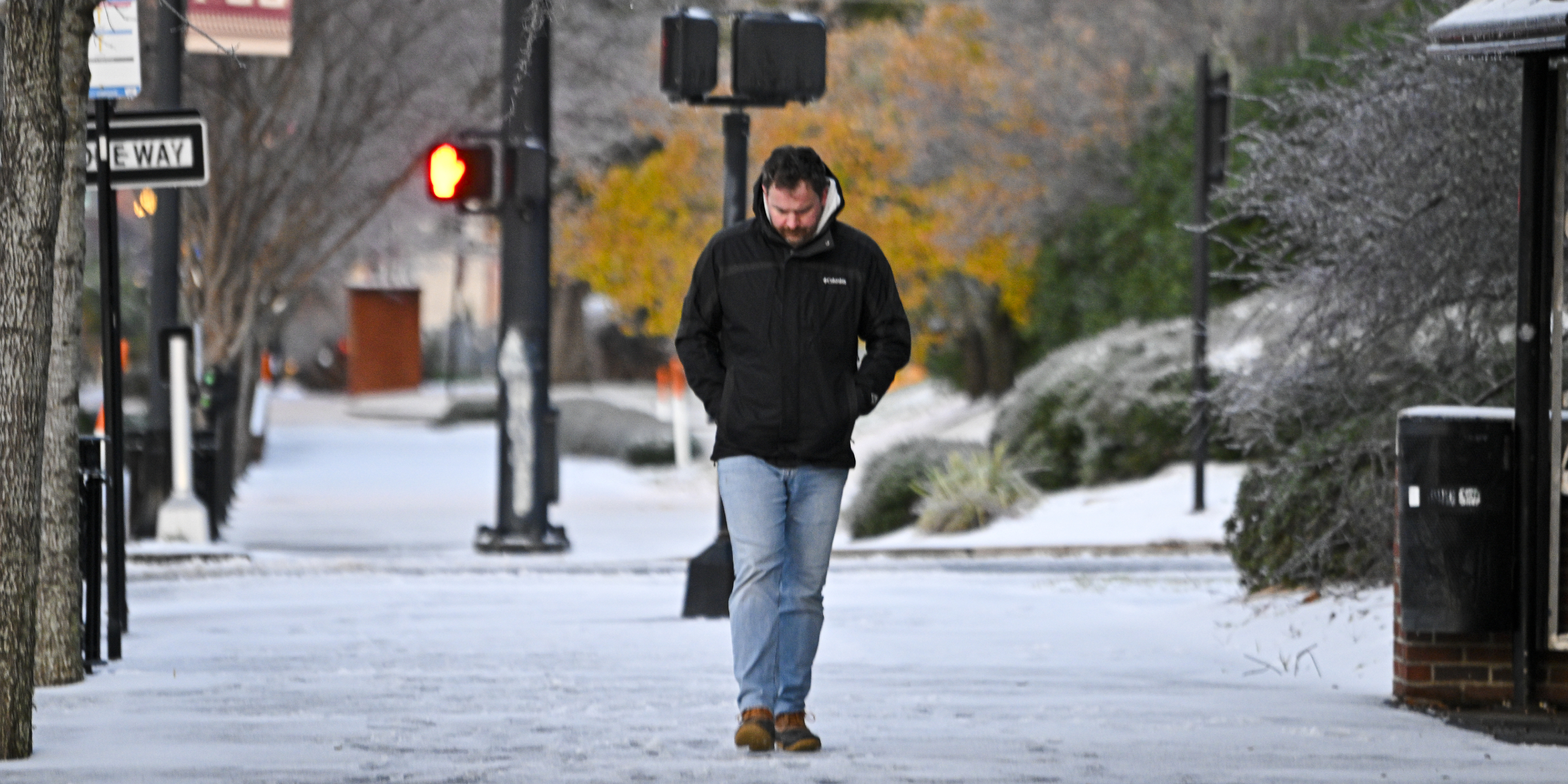 A person walks on snow after snowfall on January 22, 2025, in Tallahassee, Florida | Source: Getty Images