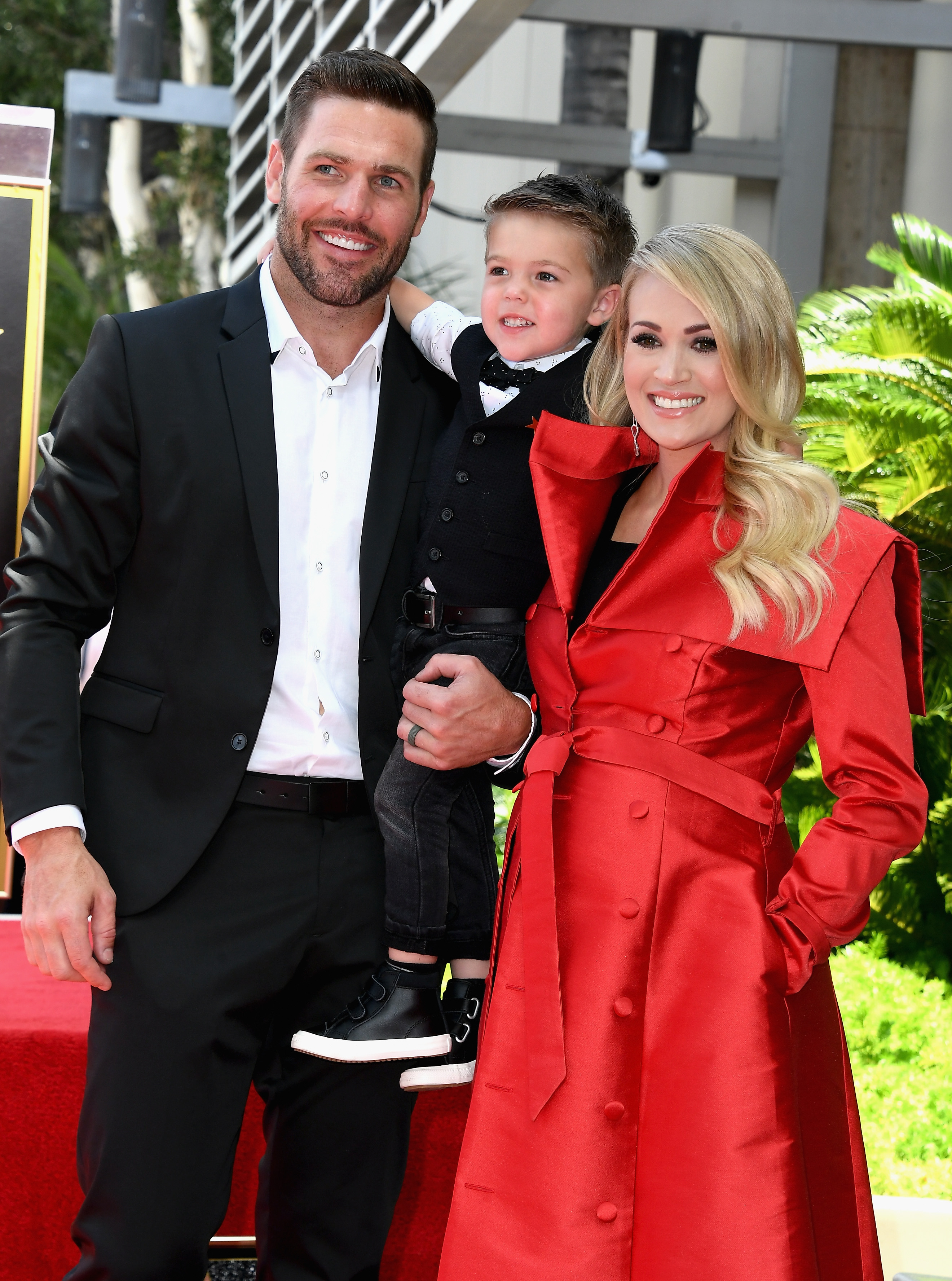 Carrie Underwood, Mike Fisher and their son Isaiah, 2016 | Source: Getty Images
