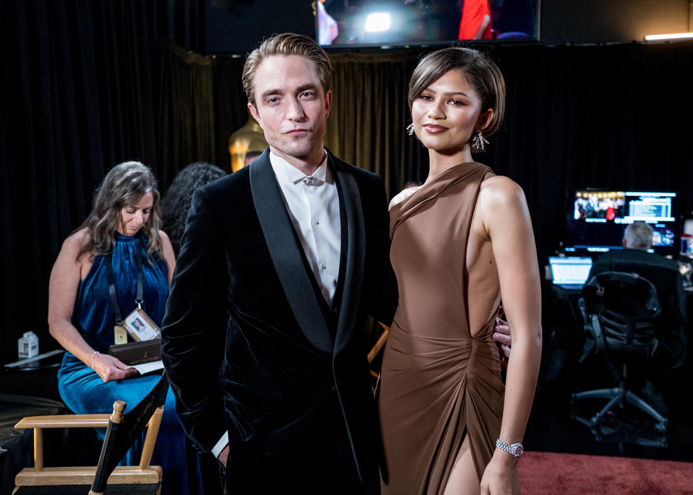 Another angle of Robert Pattinson and Zendaya at the Oscars with her tiny "t" tattoo slightly visible. | Source: Getty Images