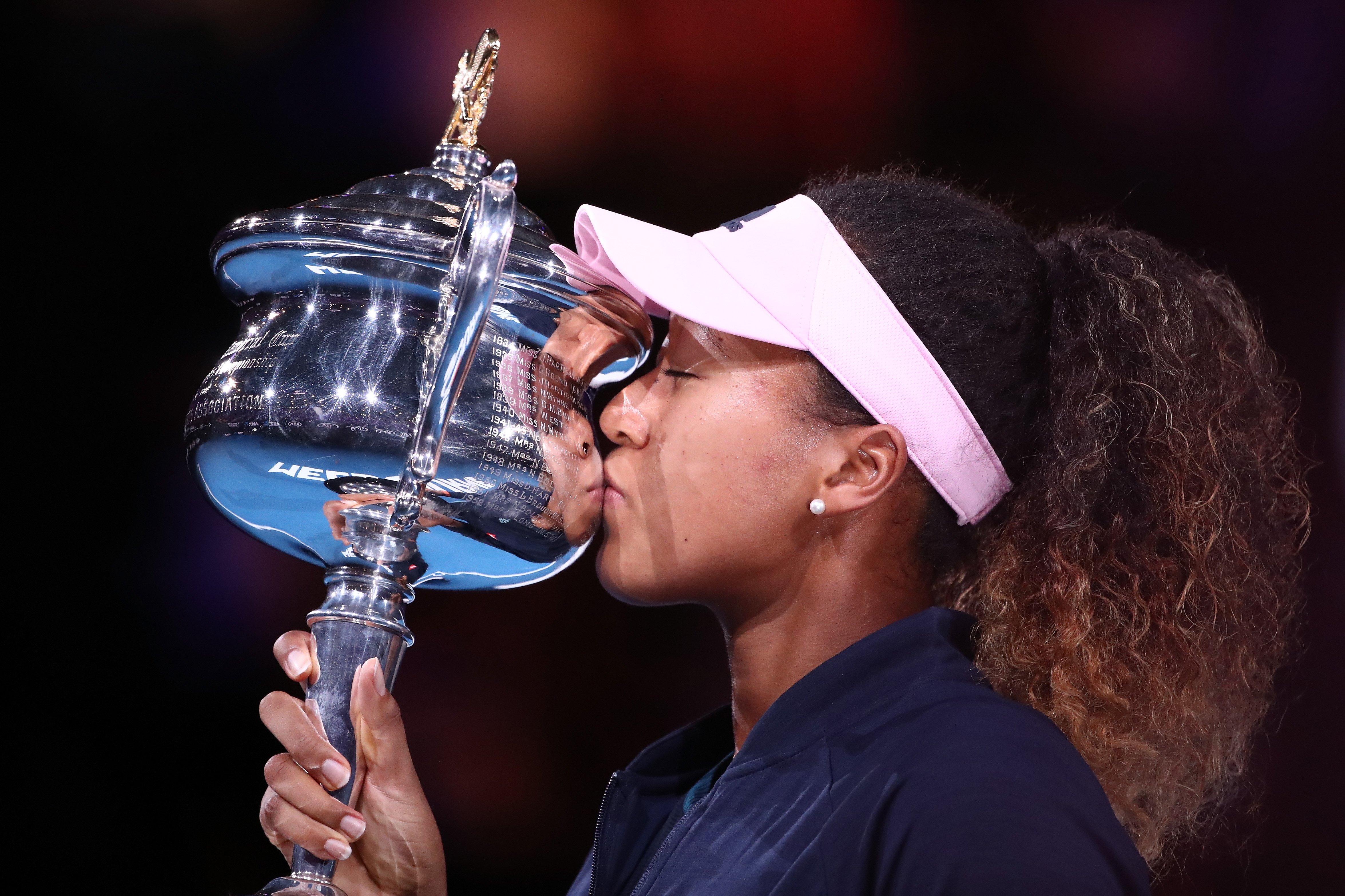 Naomi Osaka kissing her trophy after winning the Women's Singles Final during the 2019 Australian Open. | Photo: Getty Images