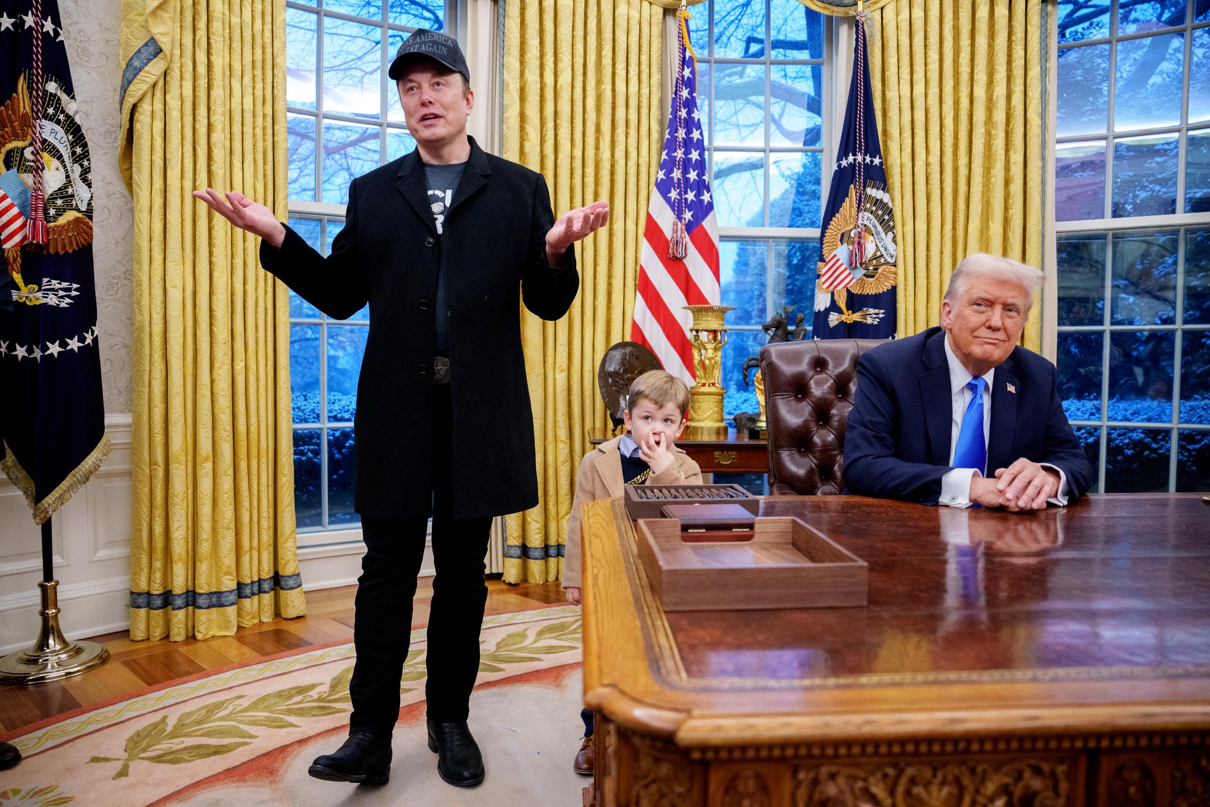 Elon Musk speaking as X Æ A-XII and Donald Trump look on. | Source: Getty Images