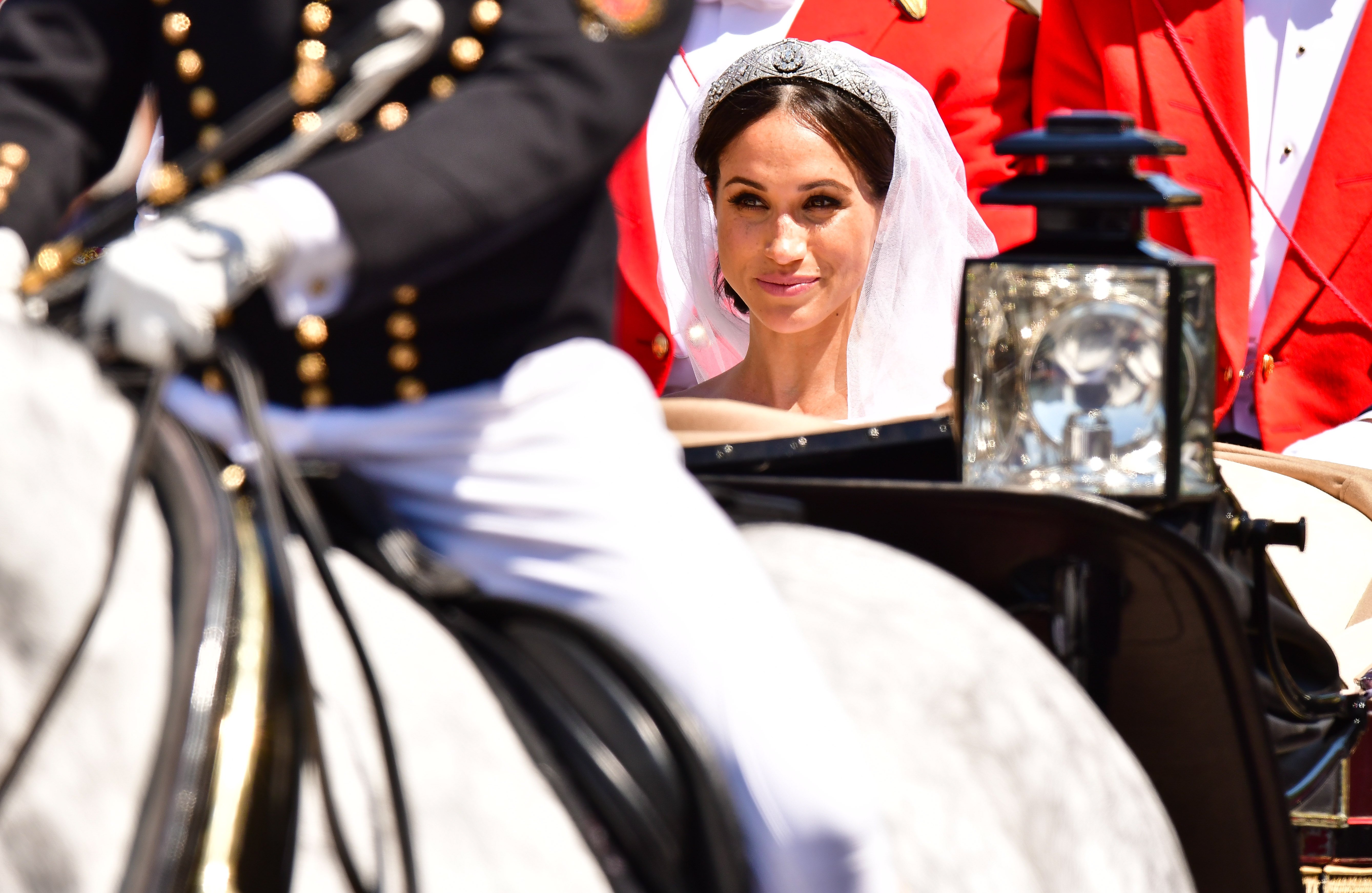 Meghan Markle leaves Windsor Castle in the Ascot Landau carriage during the procession after getting married at St George's Chapel, Windsor Castle on May 19, 2018 in Windsor, England | Source: Getty Images