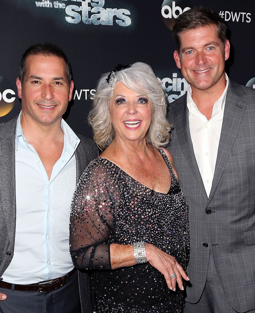 Celebrity chef/TV personality Paula Deen (C) poses with sons cook/TV personality Bobby Deen (L) and cook/TV personalitJamie Deen at 'Dancing with the Stars' Season 21  | Photo: Getty Images 