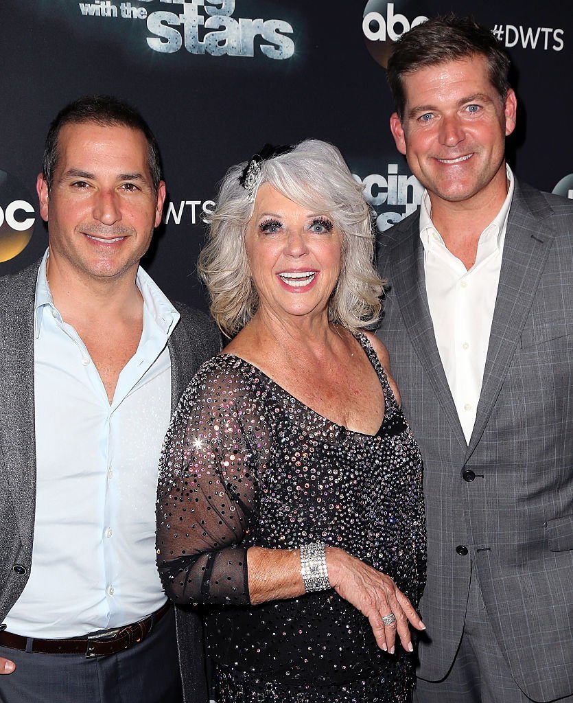 Paula Deen (C) poses with sons cook/TV personality Bobby Deen (L) and cook/TV personality Jamie Deen at 'Dancing with the Stars' Season 21 | Getty Images
