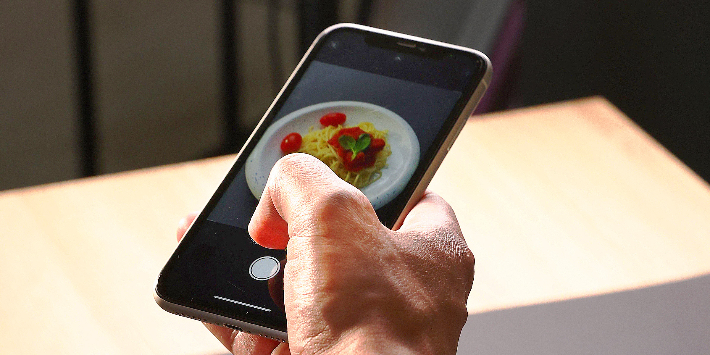 A person taking a food photo | Source: Shutterstock