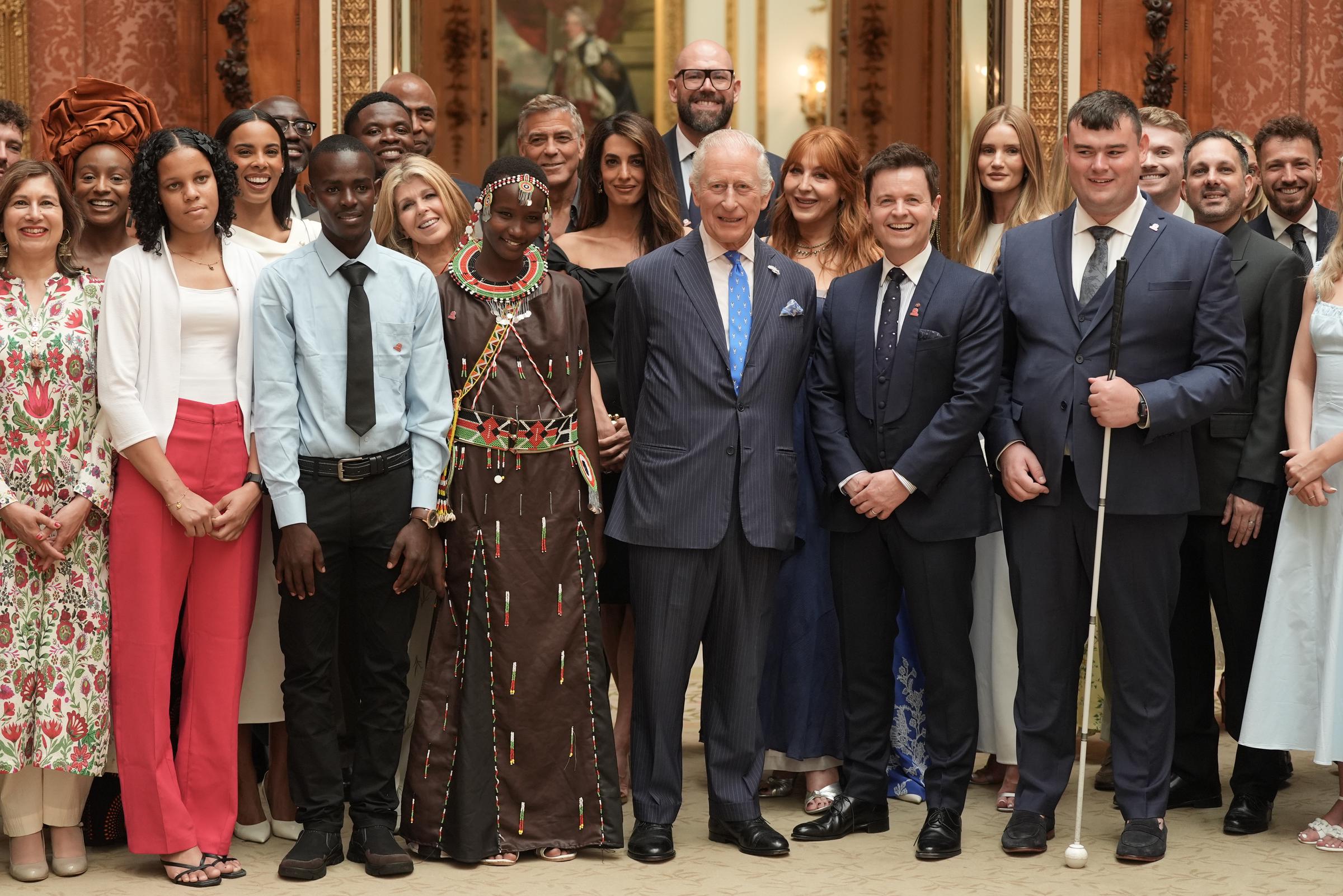 King Charles III stands with Declan Donnelly (immediate right) and other celebrities and winners of the King's Trust Awards during a reception for the winners of the King's Trust Awards at Buckingham Palace on June 25, 2025 in London, England | Source: Getty Images