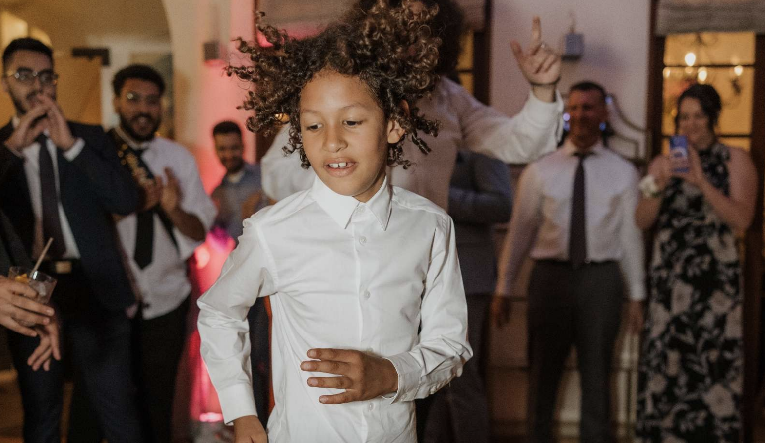Lamar McGlothurn dancing at a celebration, surrounded by family and friends | Source: State of California