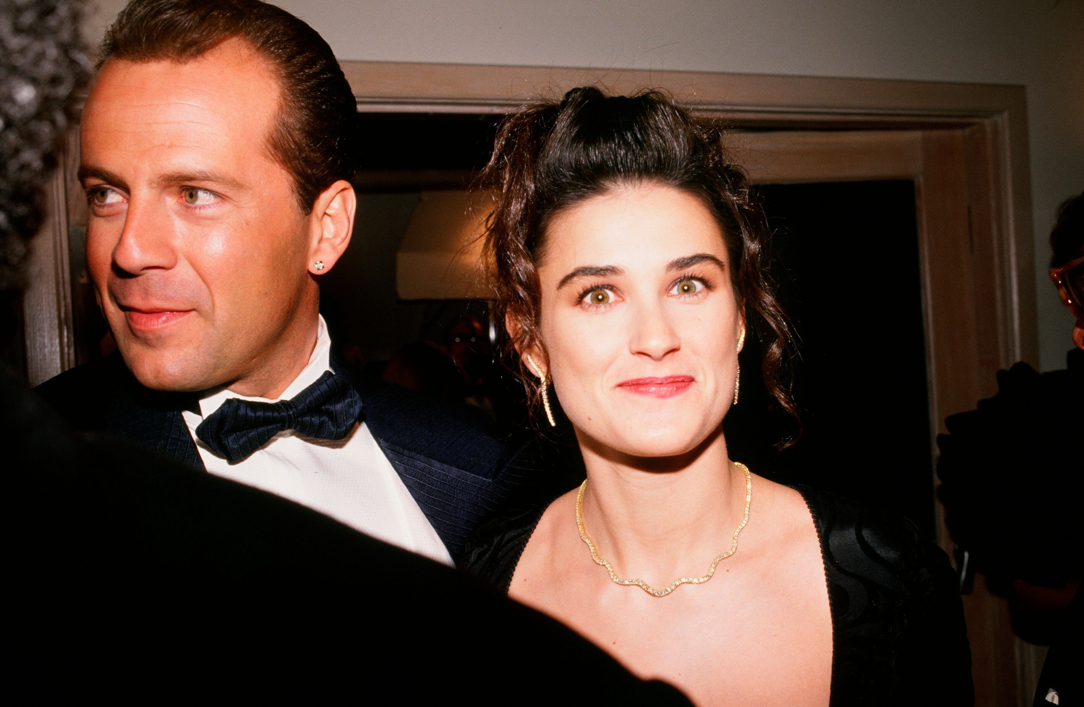 Bruce Willis and Demi Moore arrive at the 1989 West Hollywood, California, Irving "Swifty" Lazar Oscar Party. | Source: Getty Images