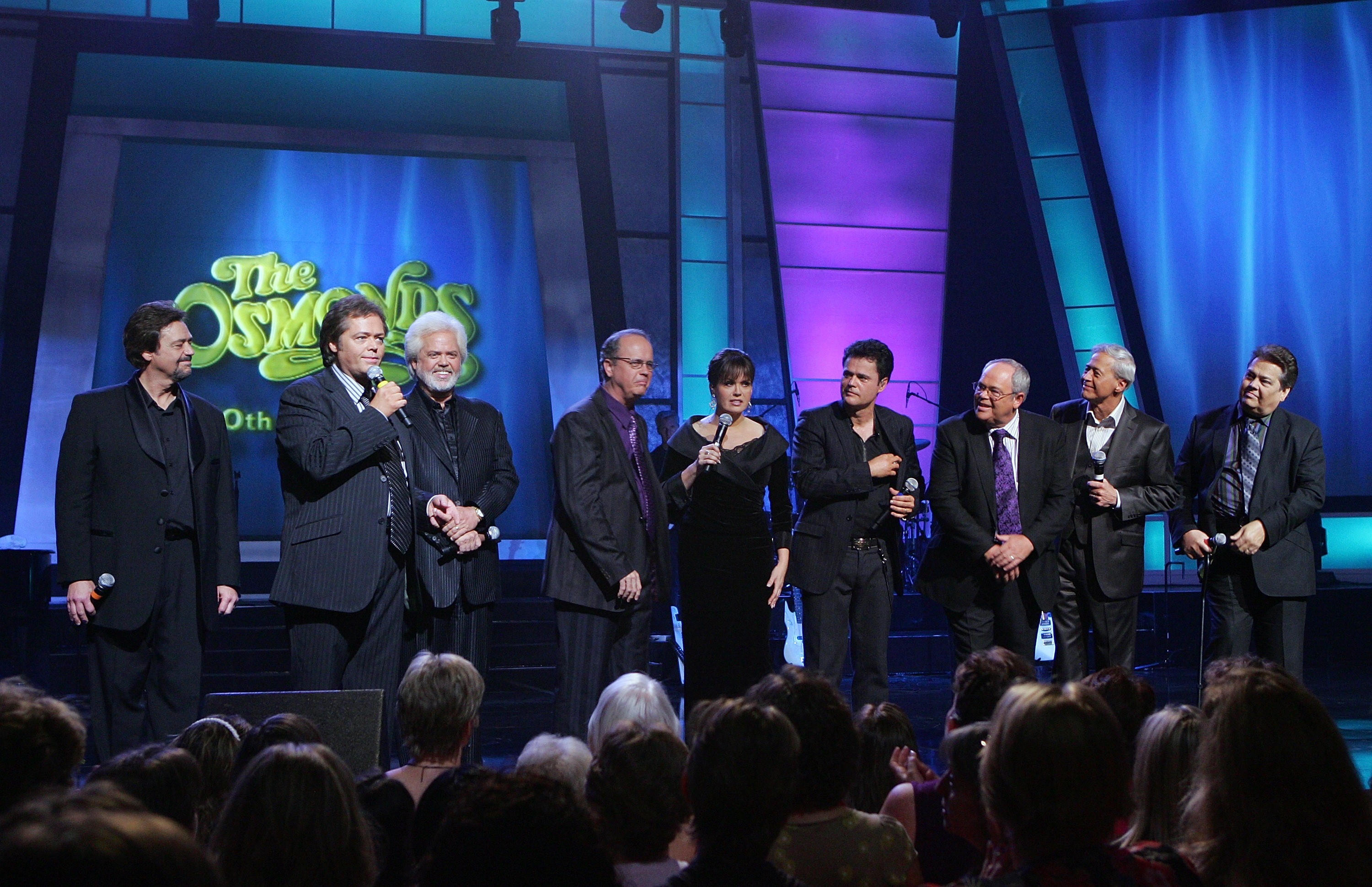 Jay, Jimmy, Merrill, Virl, Marie, Donny, Tom, Wayne, and Alan Osmond, on stage at the Orleans Hotel & Casino in Las Vegas, Nevada, on August 14, 2007. | Source: Getty Images
