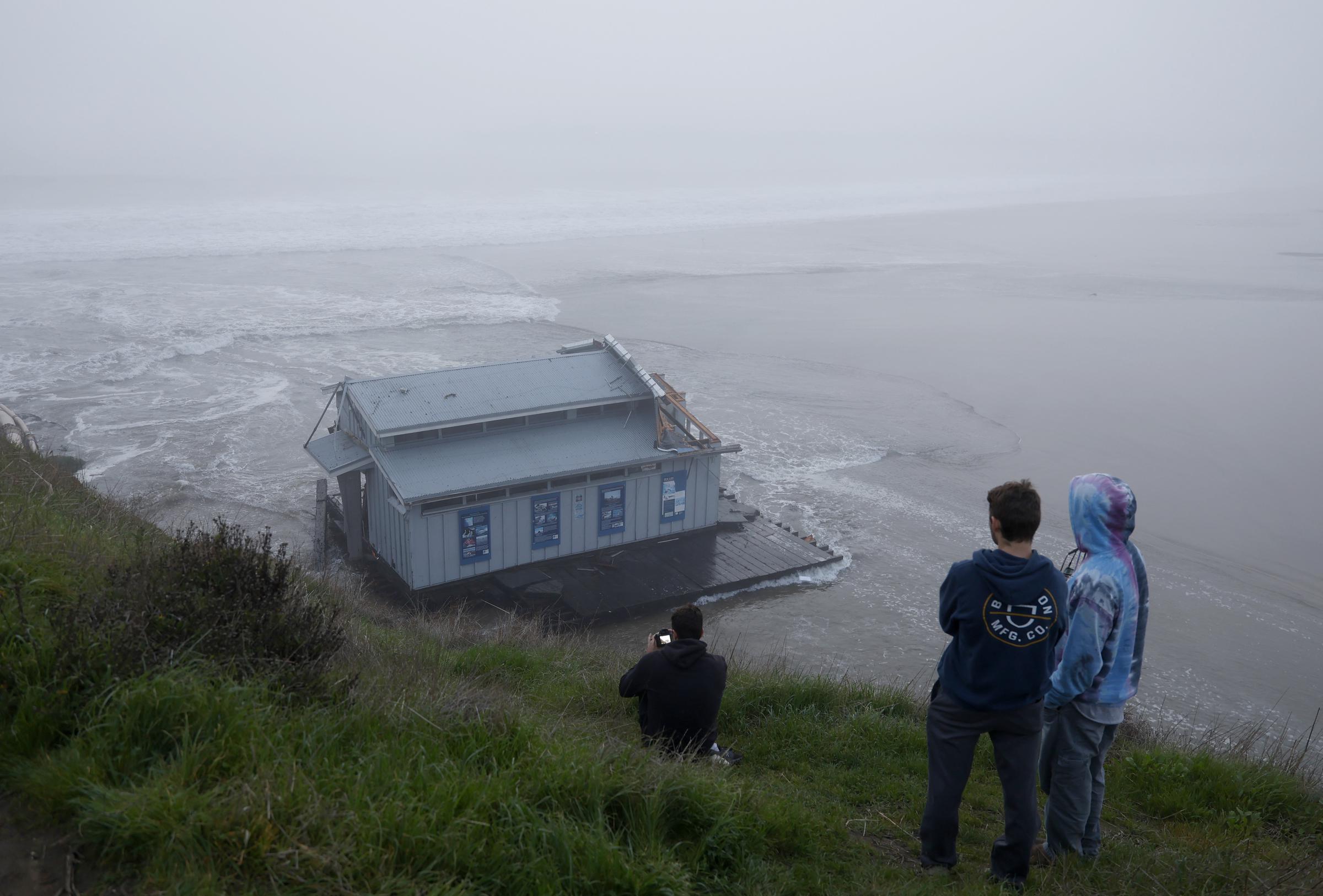 People look at the collapsed pier at the Santa Cruz Wharf in Santa Cruz, California, on December 23, 2024 | Source: Getty Images