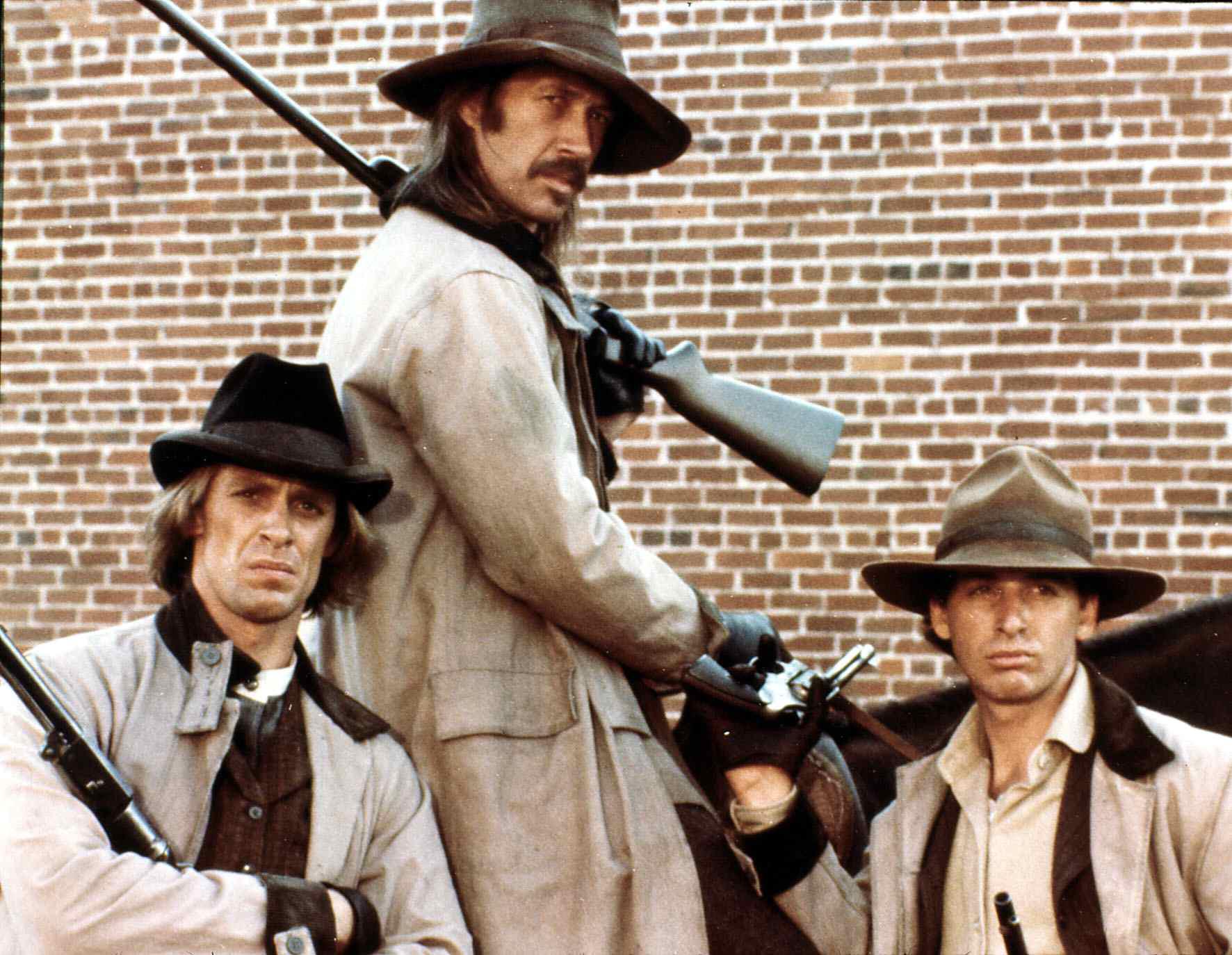 Keith, David, and Robert Carradine posing as their characters from "The Long Riders." | Source: Getty Images