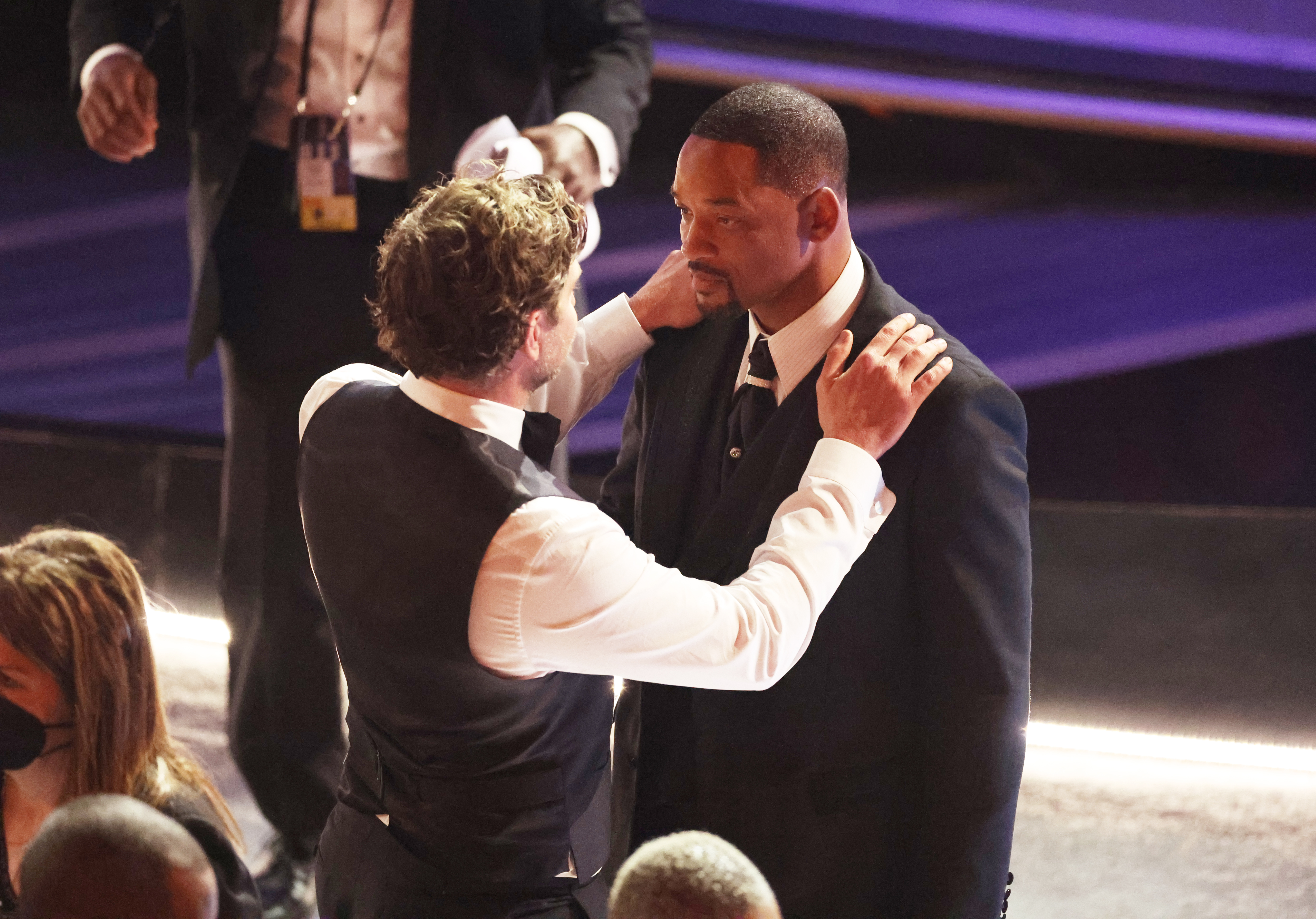Bradley Cooper comforts Will Smith during the 94th Academy Awards at the Dolby Theatre at Ovation Hollywood on Sunday, March 27, 2022. | Source: Getty Images